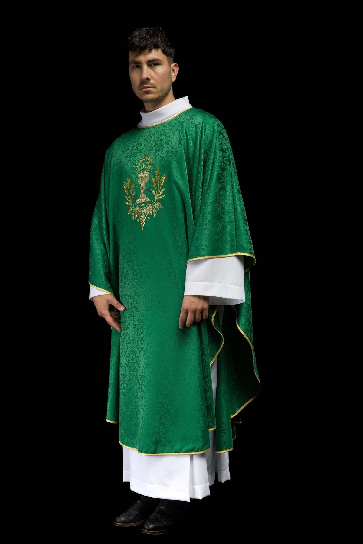Green liturgical chasuble, three-quarter view with gold trim and front embroidery
