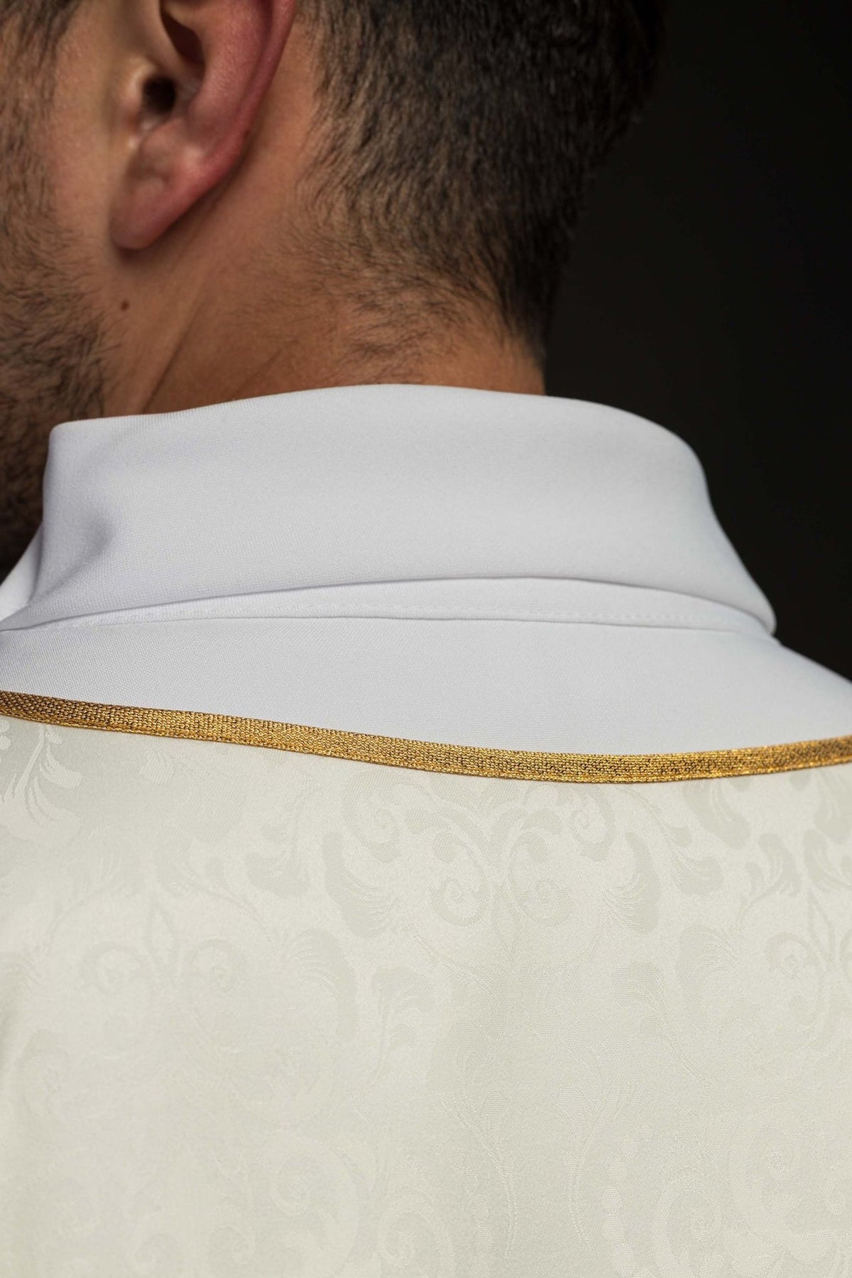 Ecru chasuble back collar close-up with gold trim and jacquard fabric