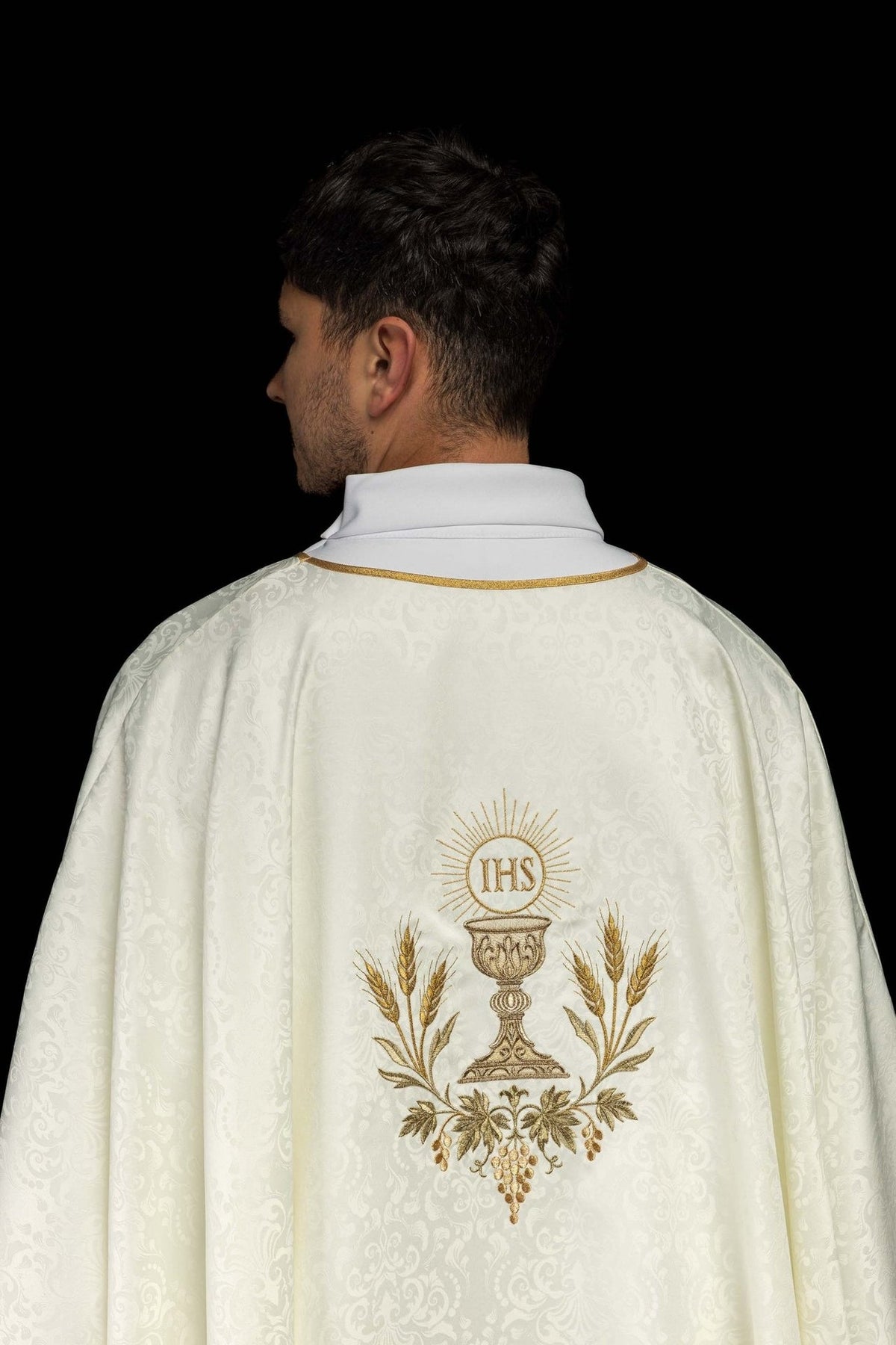 Ecru chasuble back view with Eucharistic embroidery, gold trim and jacquard fabric