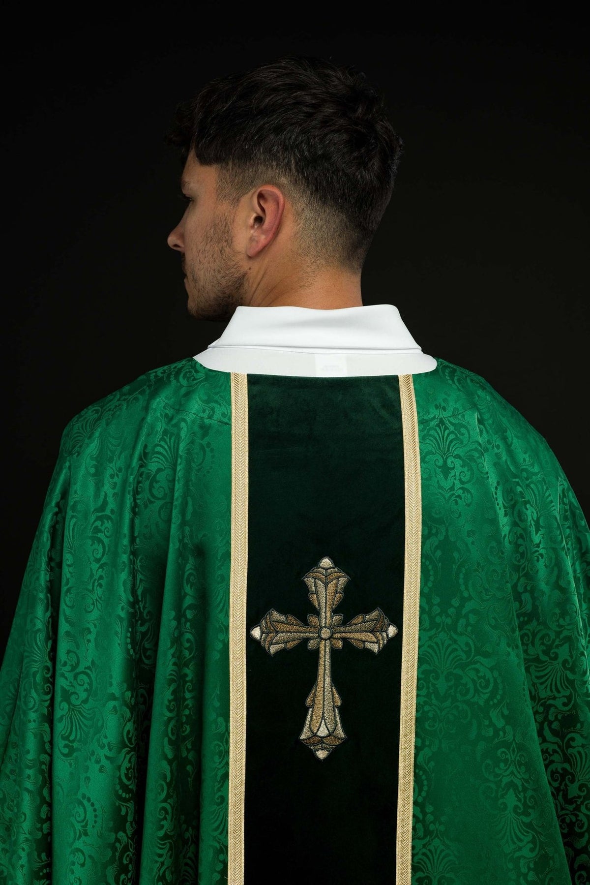 Green chasuble back view with gold orphrey and cross embroidery