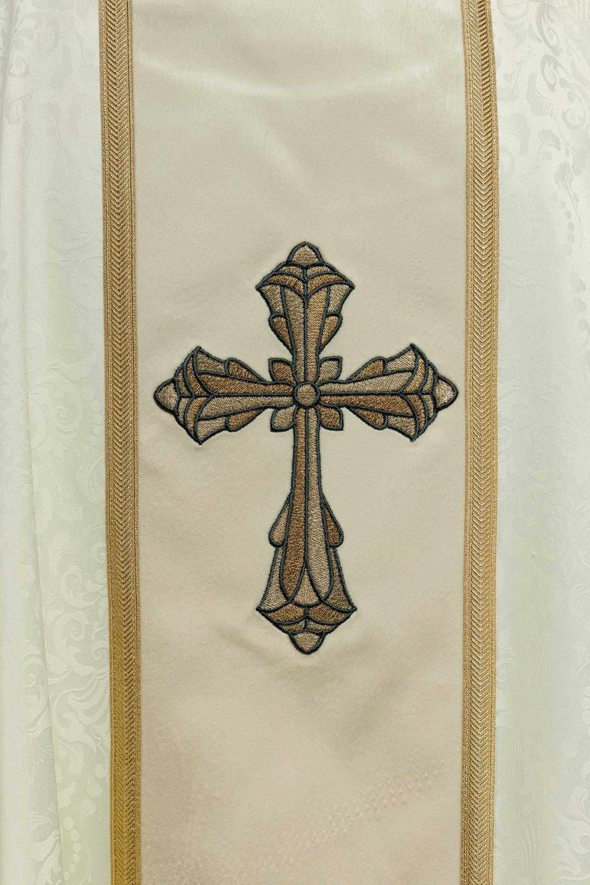 Ecru chasuble close-up of gold cross embroidery on the front orphrey