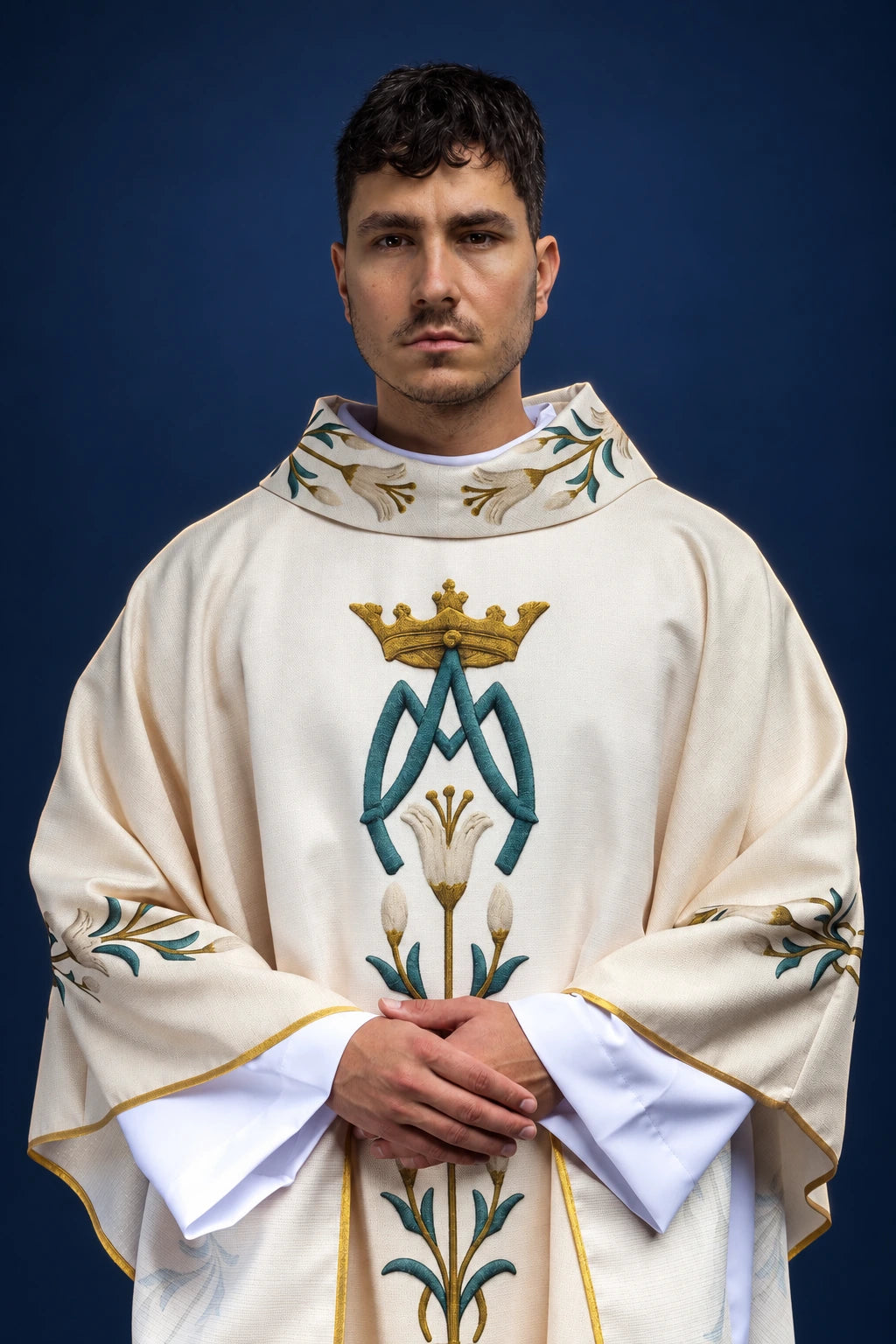 Marian chasuble with printed lily pattern and ecru monogram, front view in cream with gold trim
