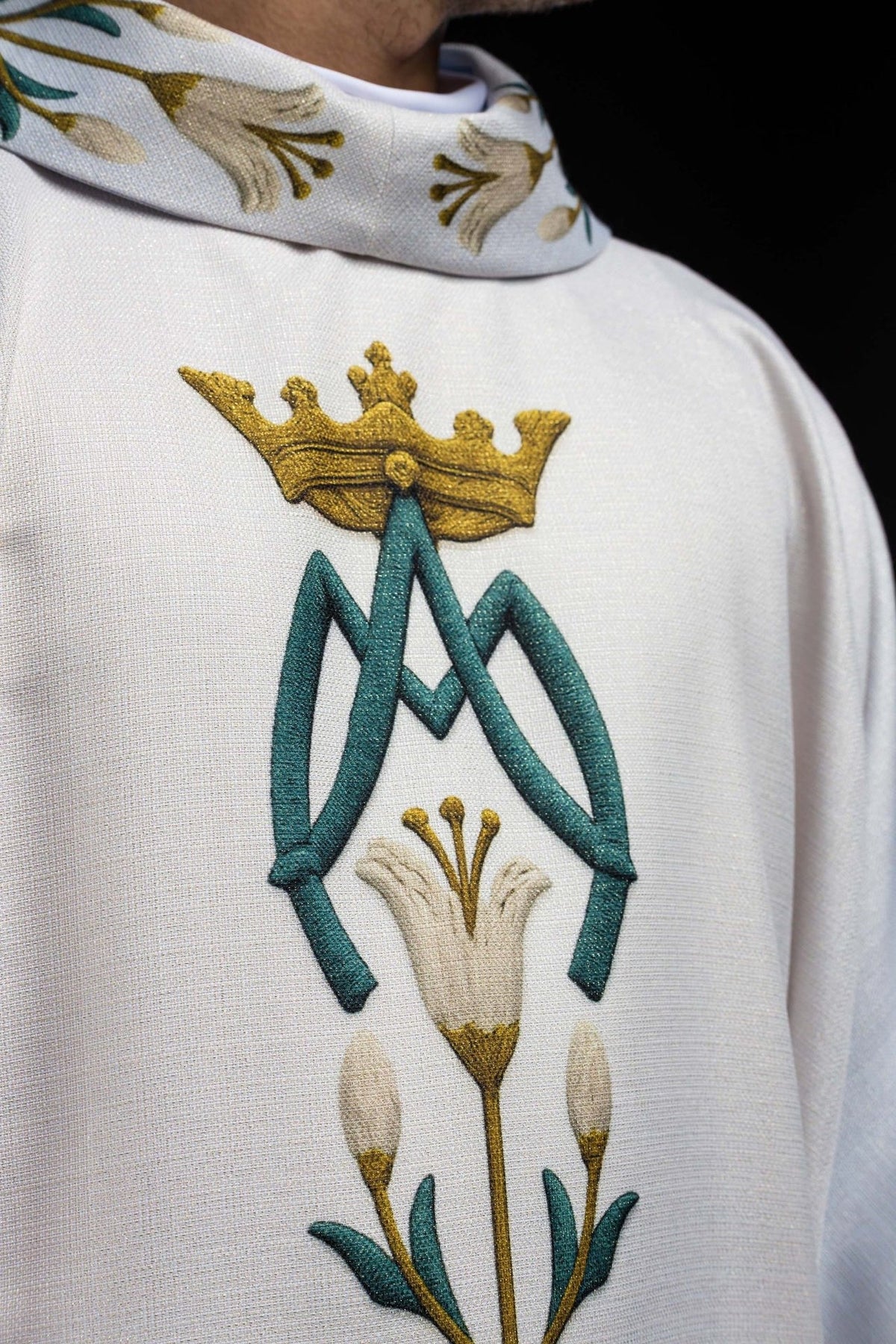 Marian chasuble close-up of crowned AM monogram and lily embroidery