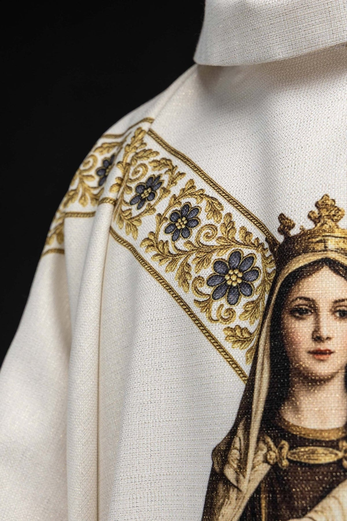 Marian chasuble close-up of floral gold orphrey and Marian symbol
