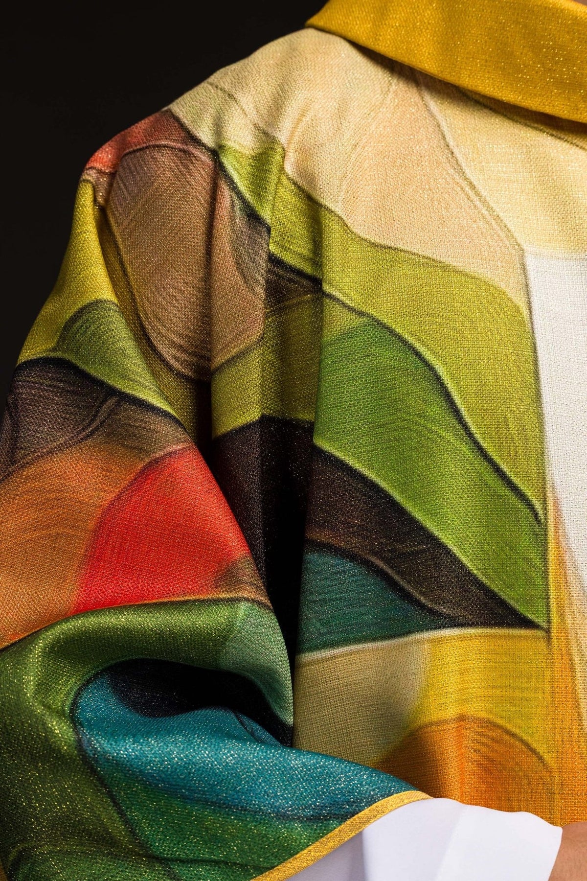 Multicolored chasuble close-up showing green, brown, red and gold printed sections