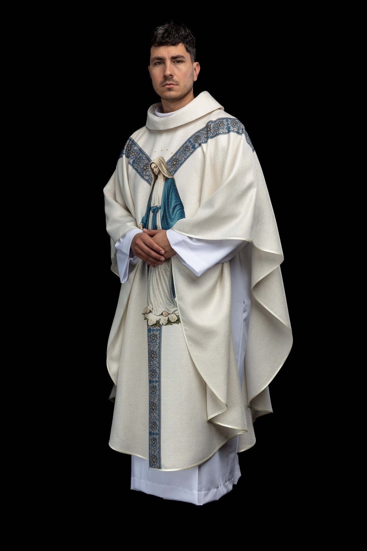 Chasuble with Our Lady image, angled front view showing the flowing ecru fabric