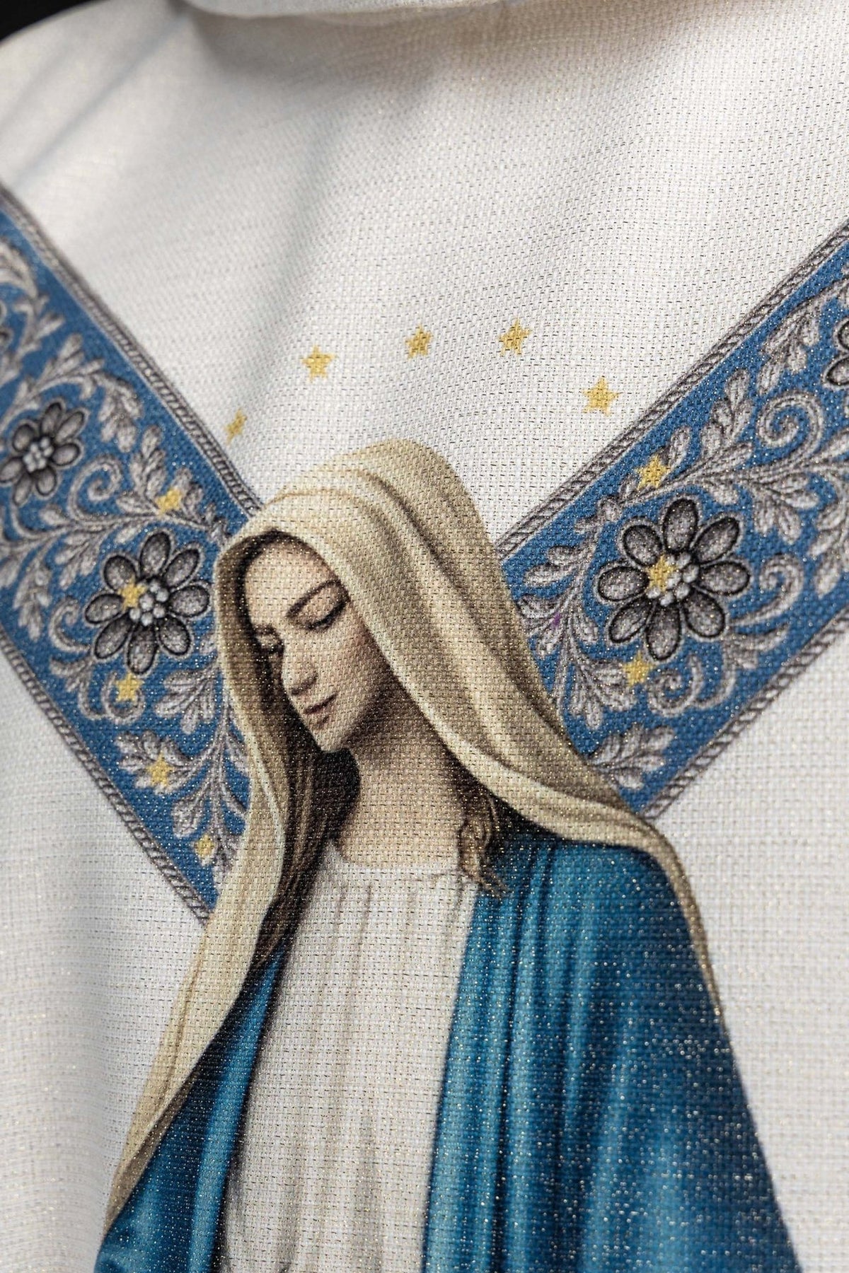 Chasuble with Our Lady image, close-up of the printed face and light blue floral trim