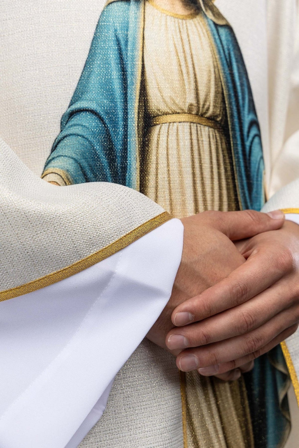Marian chasuble sleeve close-up with gold trim and Our Lady print