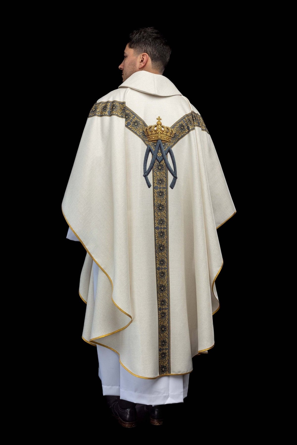 Marian chasuble back view with blue floral orphrey, gold crown and Marian symbol