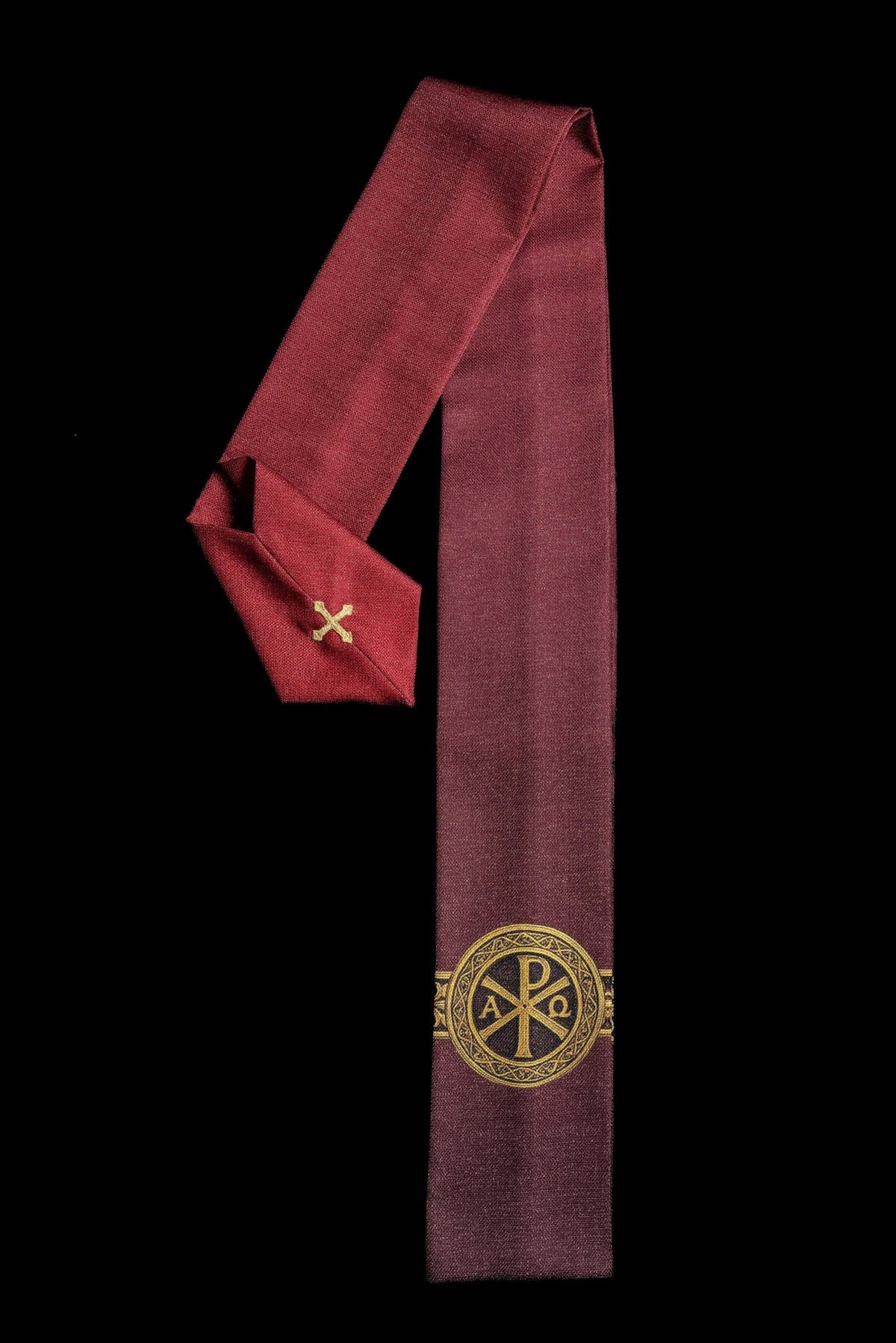 Red chasuble with gold Pax symbol and ornate gold orphrey
