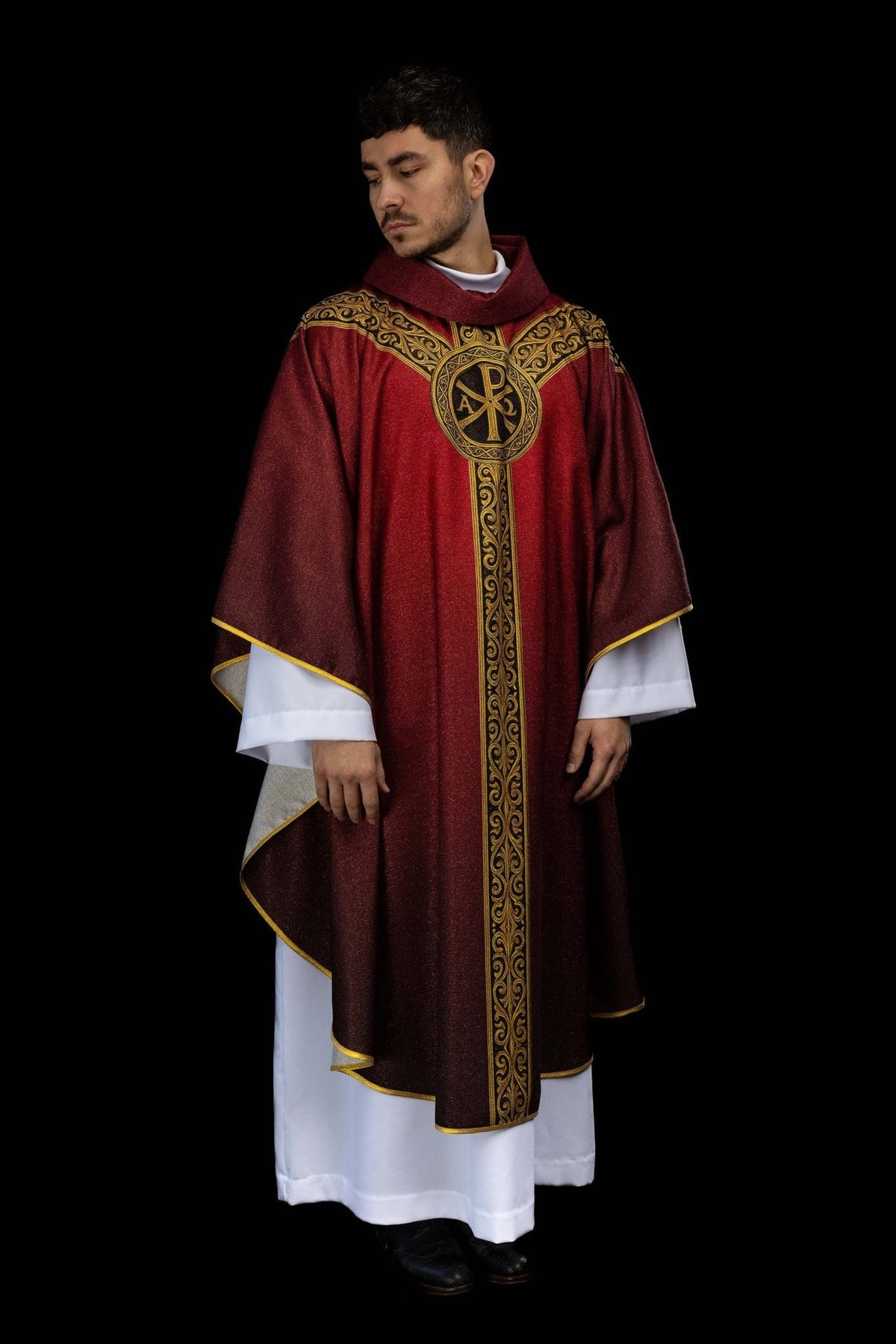 Red chasuble front view with gold Pax symbol and ornate trim