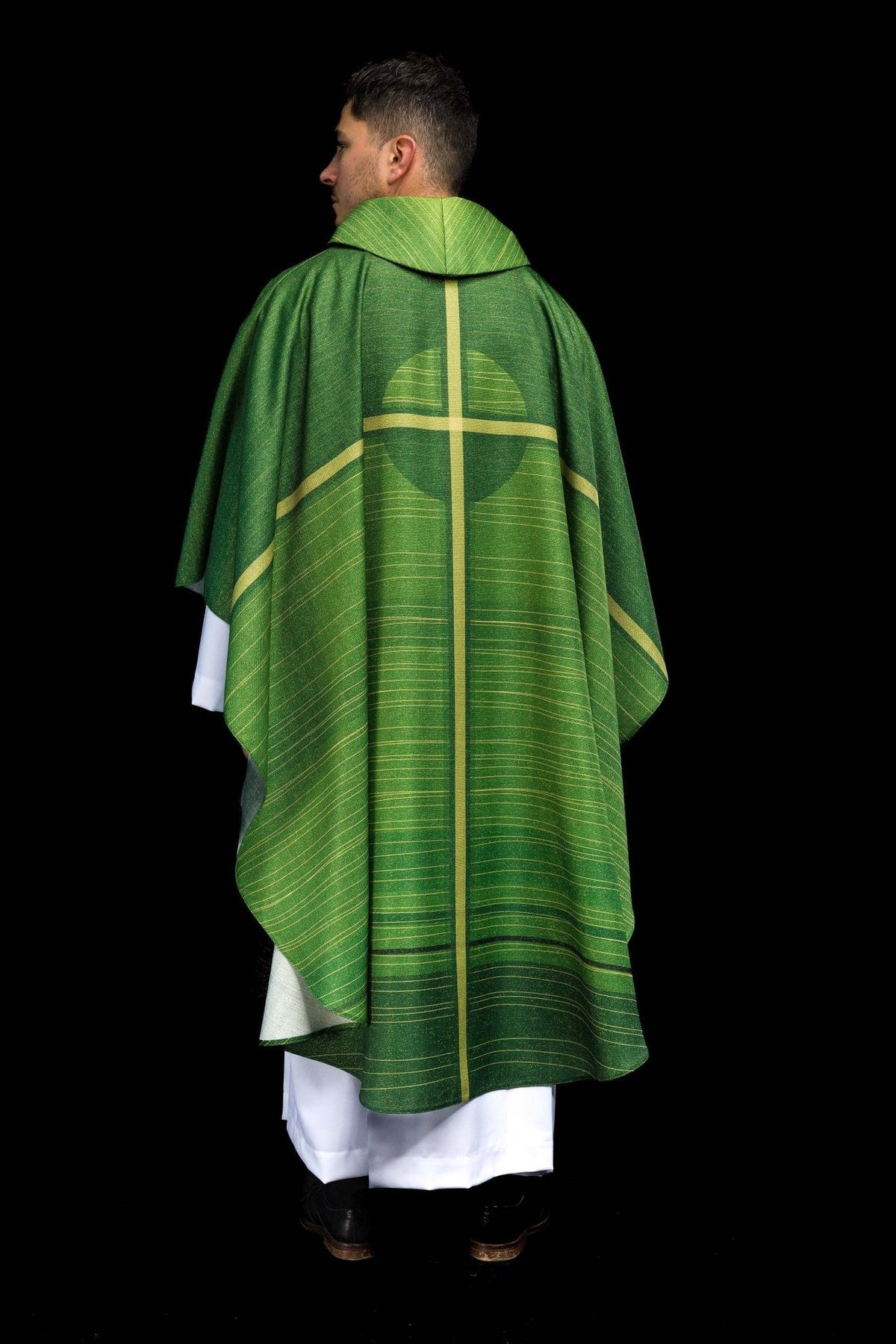 Green chasuble back view with gold cross motif and central stripe