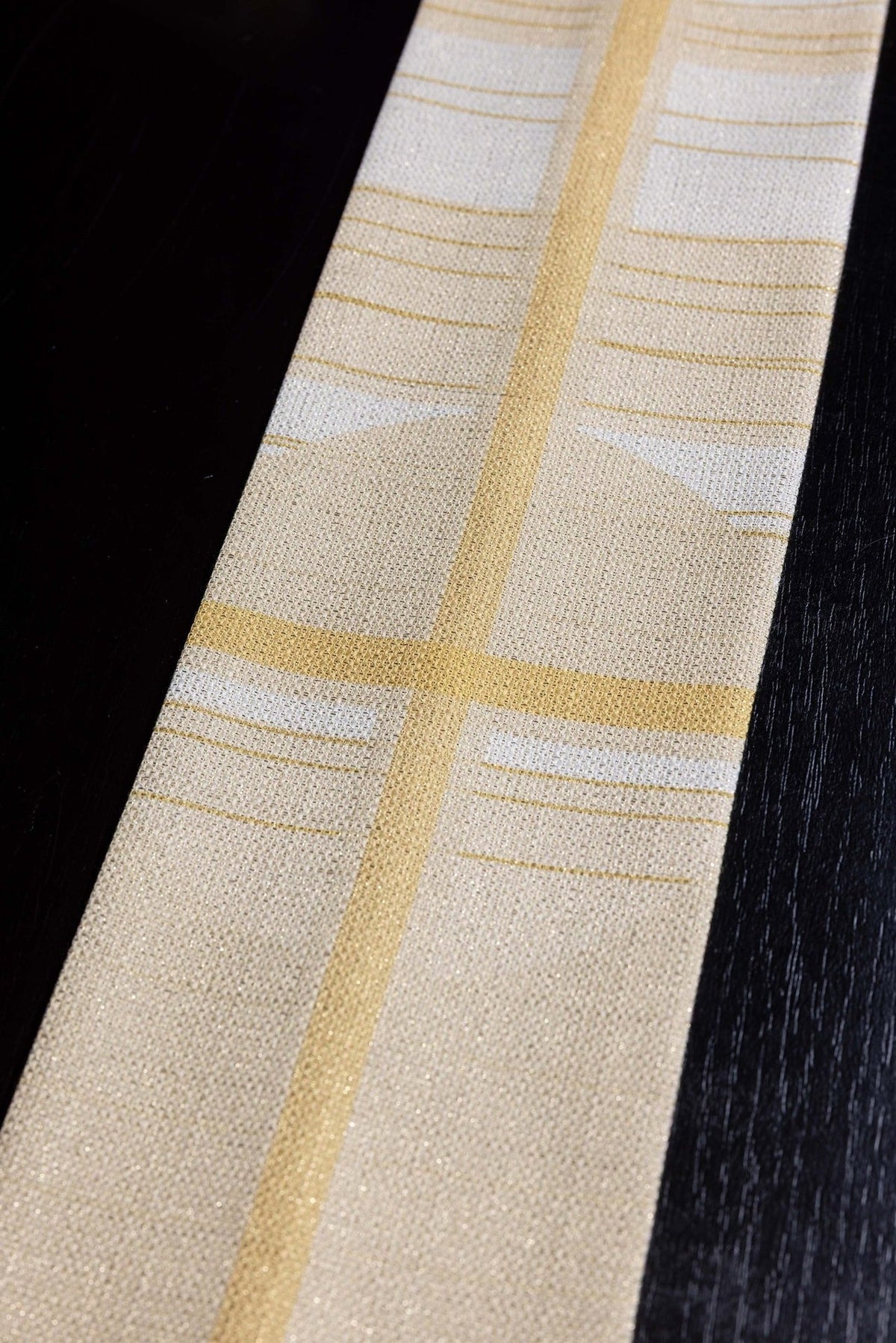 Ecru stole with printed cross motif laid flat