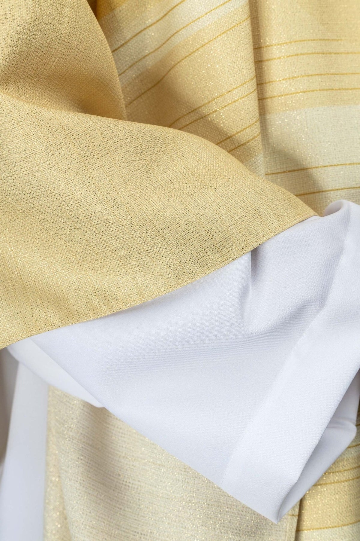 Ecru chasuble sleeve and cross-print detail