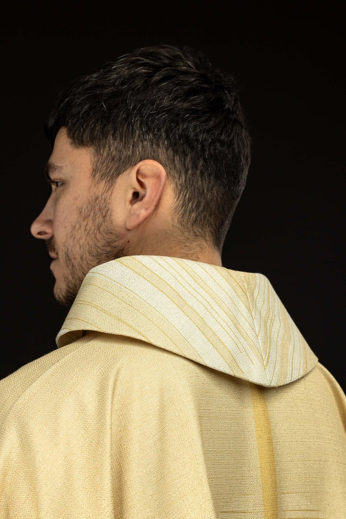 Ecru chasuble fabric and sleeve close-up