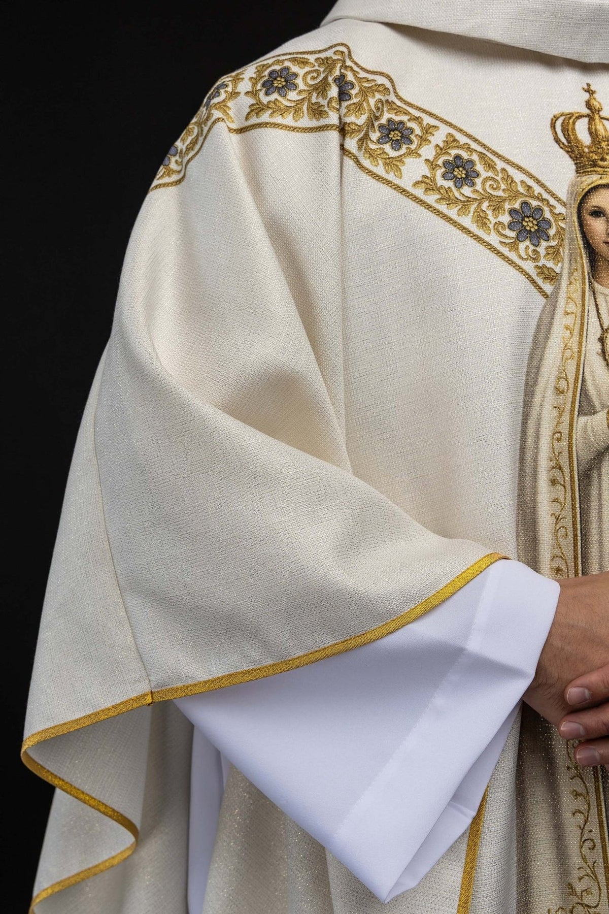 Our Lady of Fatima chasuble side detail showing ecru fabric and gold edge trim