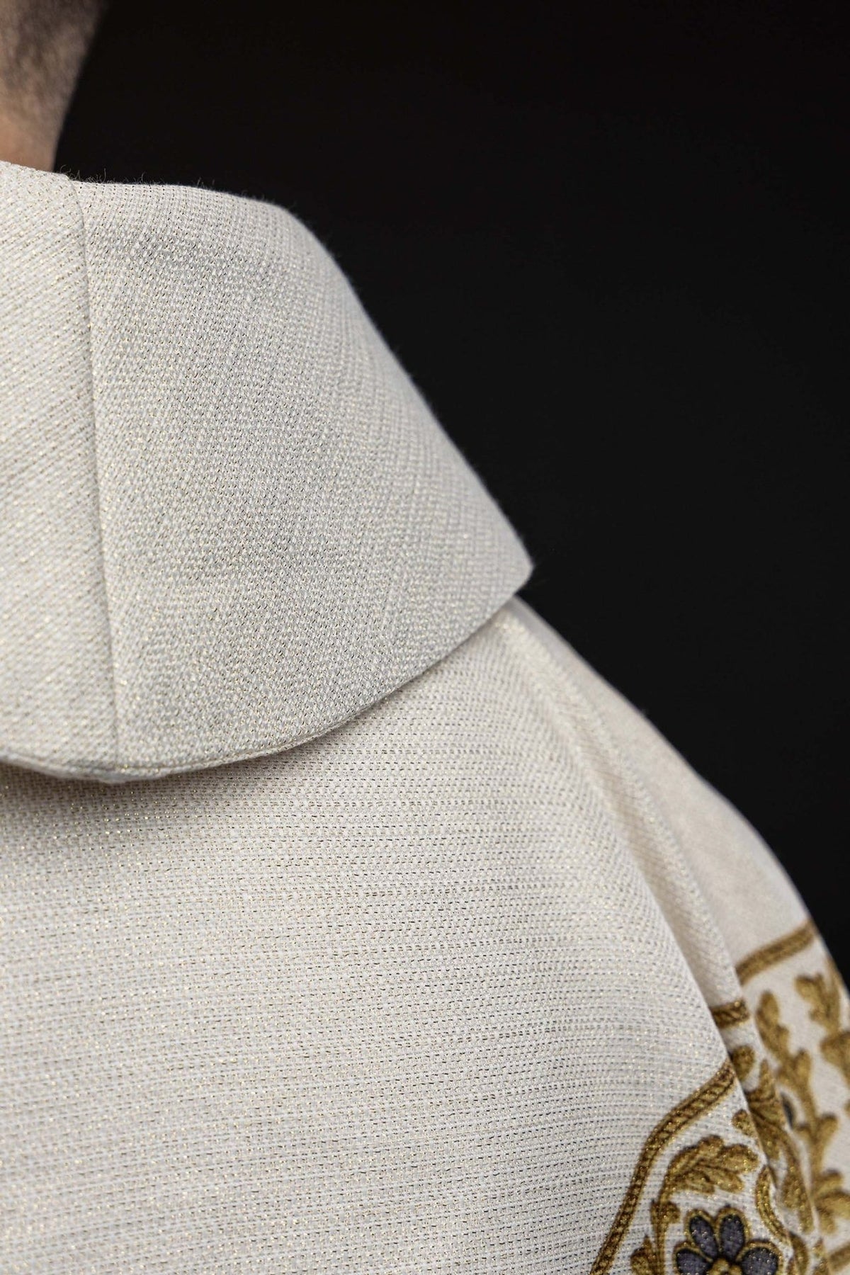 Our Lady of Fatima chasuble close-up showing ecru woven fabric and collar