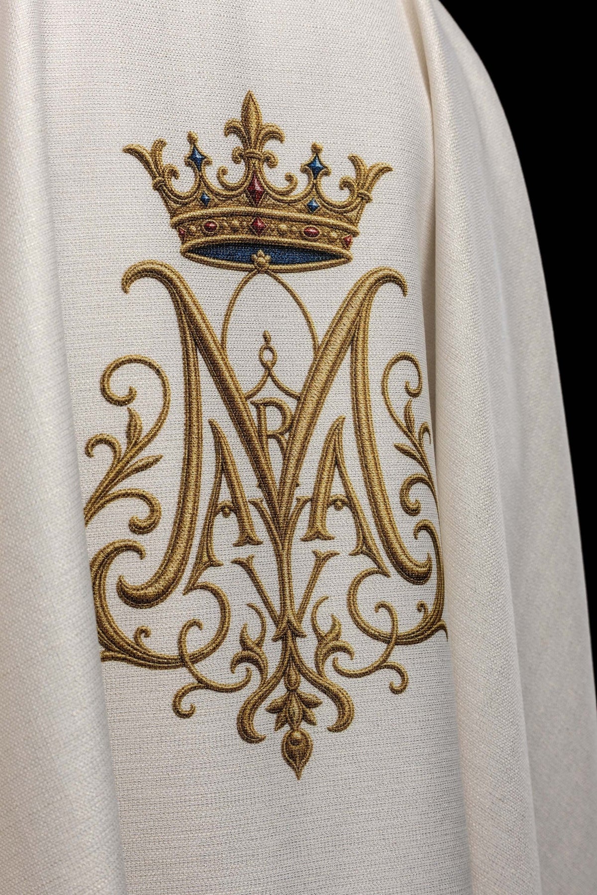 Printed chasuble worn from the back with embroidered Marian monogram and crown