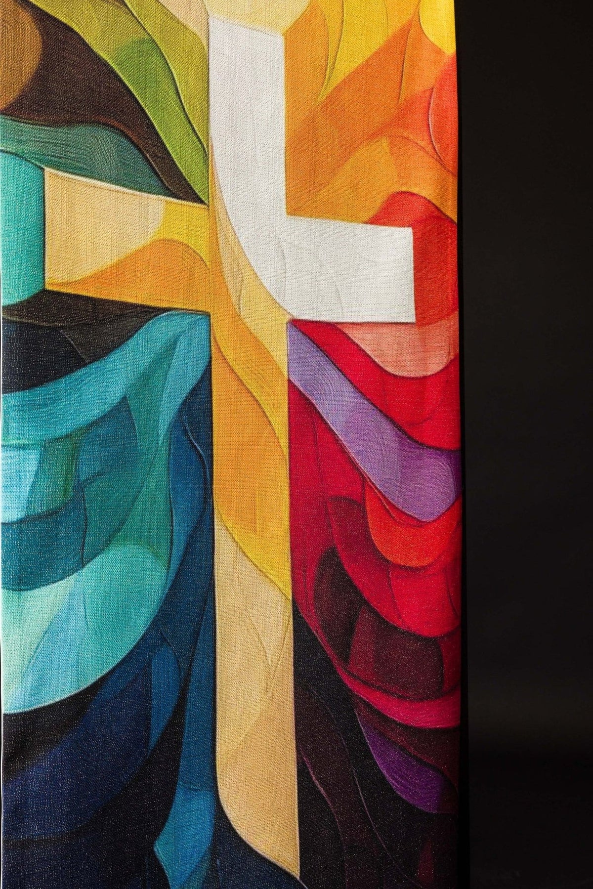 Lectern cover detail showing the lower multicolored print and cross edge