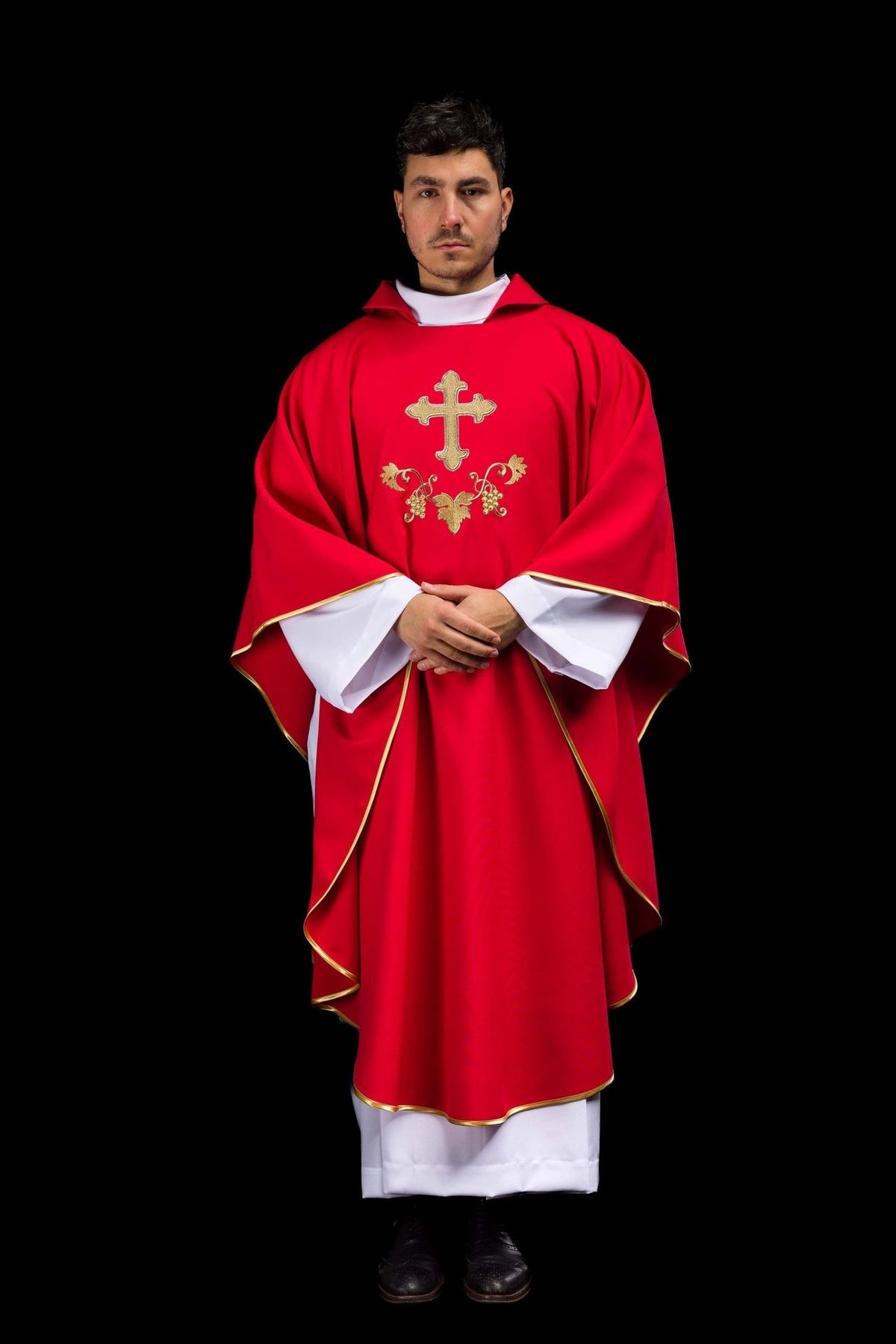 Red chasuble front view showing flowing shape, wide collar and gold trim