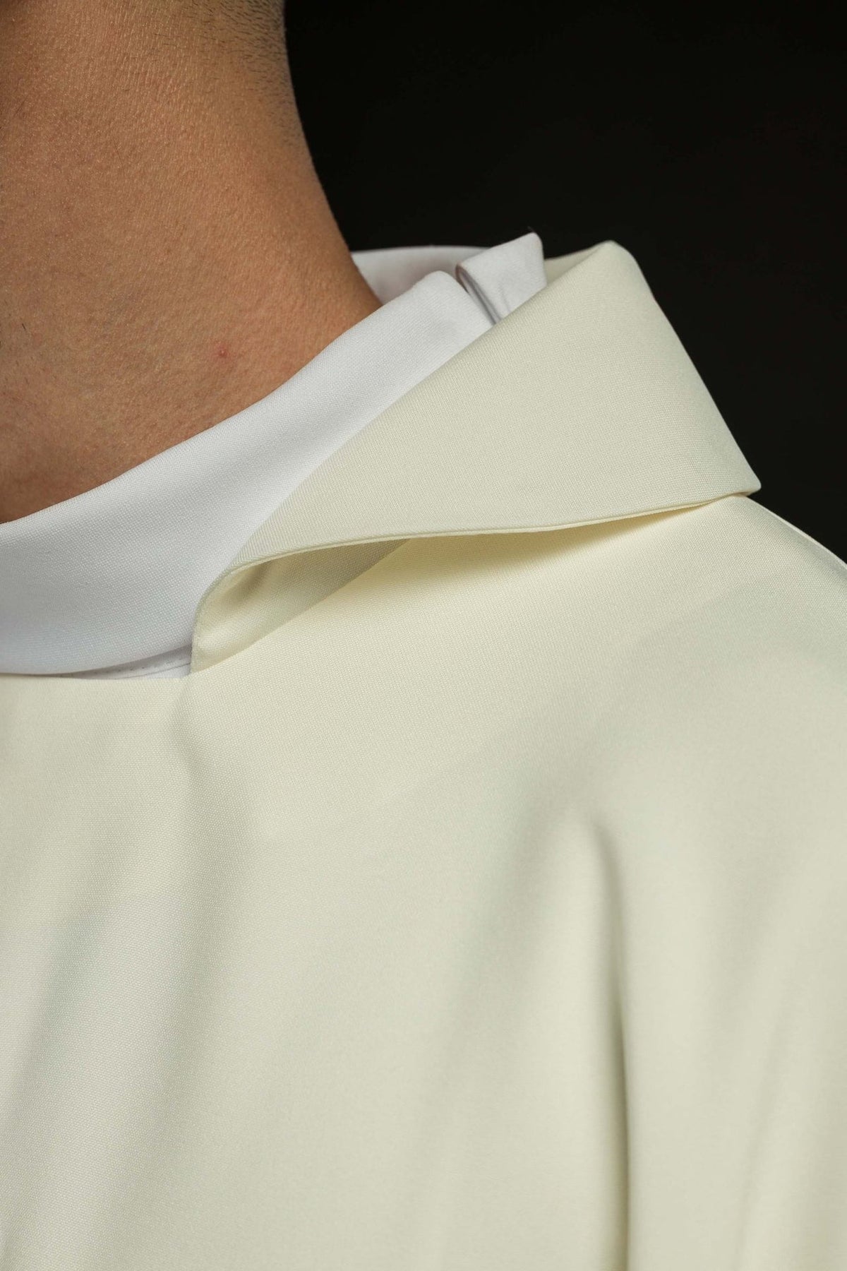 Embroidered chasuble close-up of wide ecru collar and satin fabric