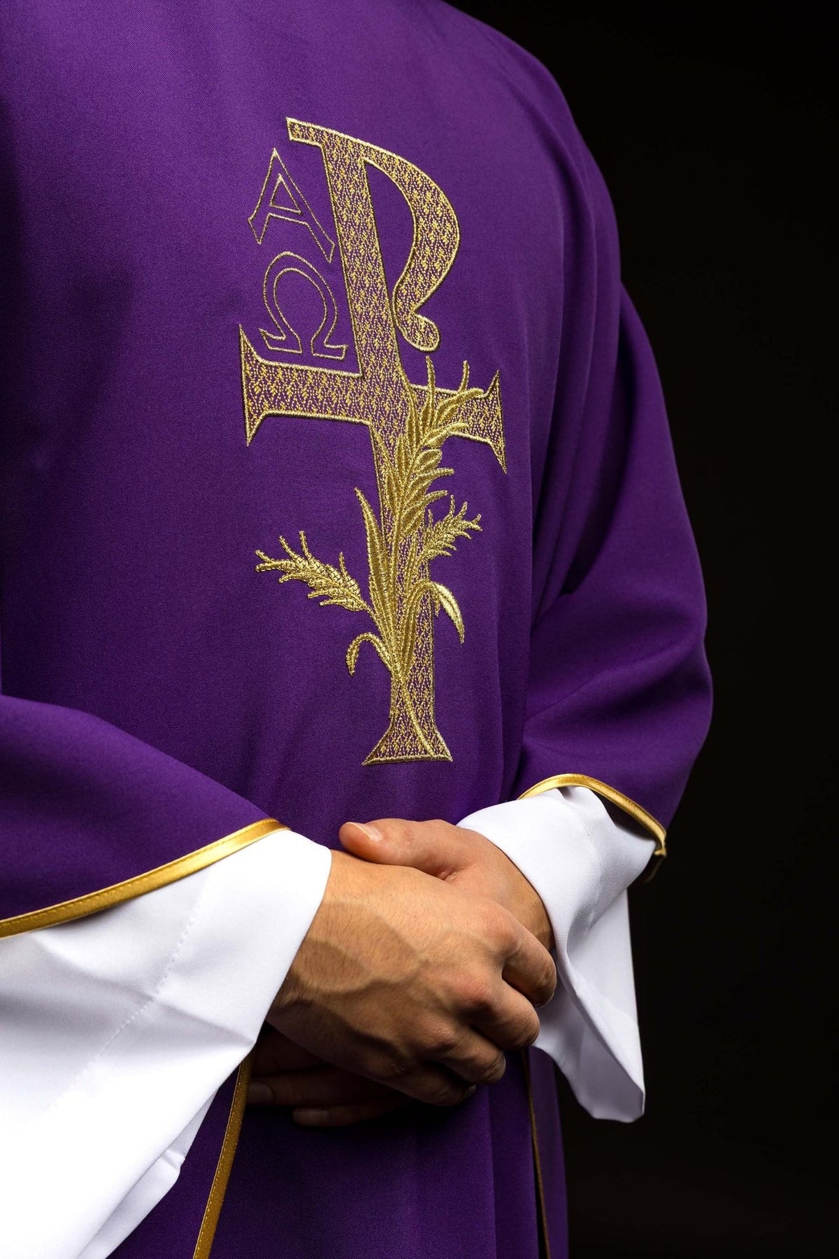 Purple chasuble side front view with gold embroidered Alpha Omega symbol
