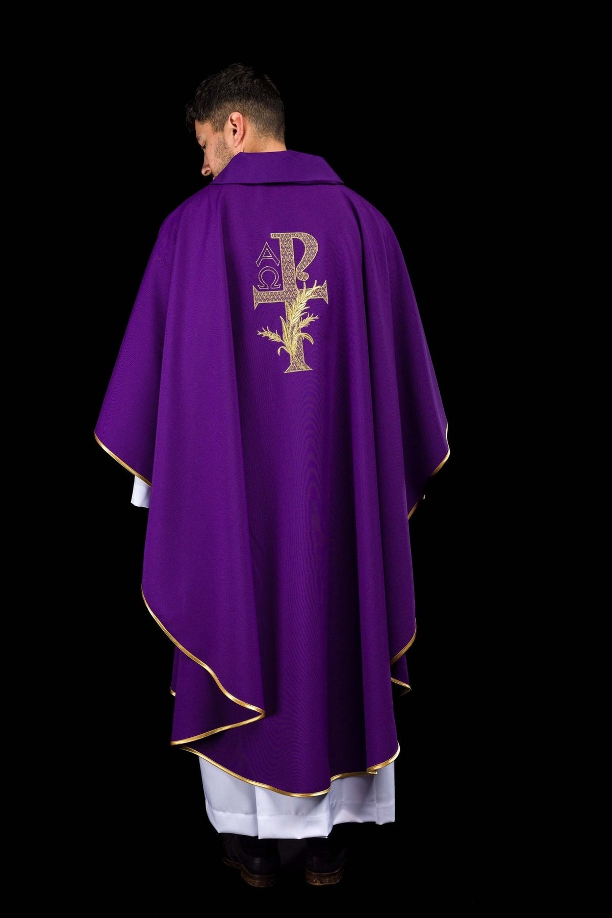 Purple chasuble back view with embroidered Alpha Omega symbol and gold trim