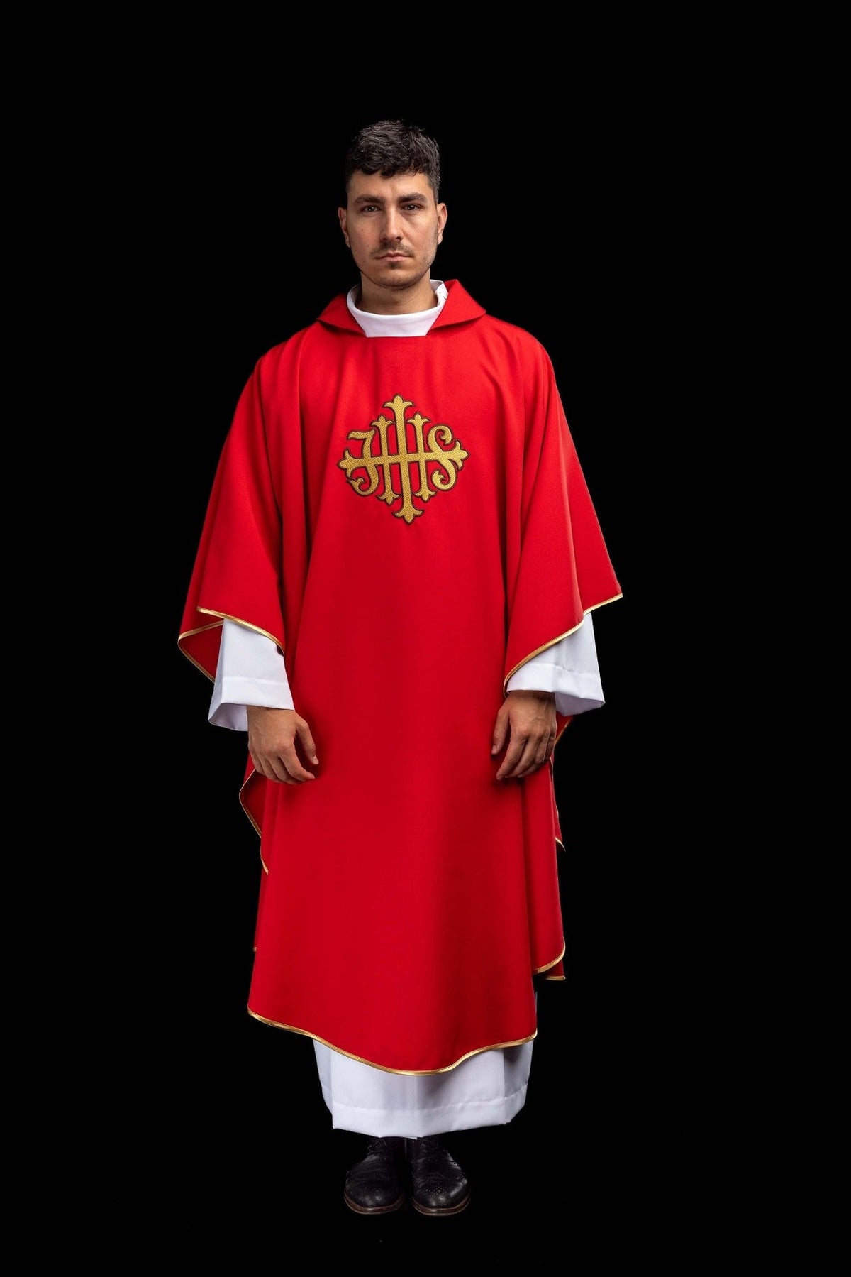 Red chasuble front view with gold embroidered JHS symbol and trim