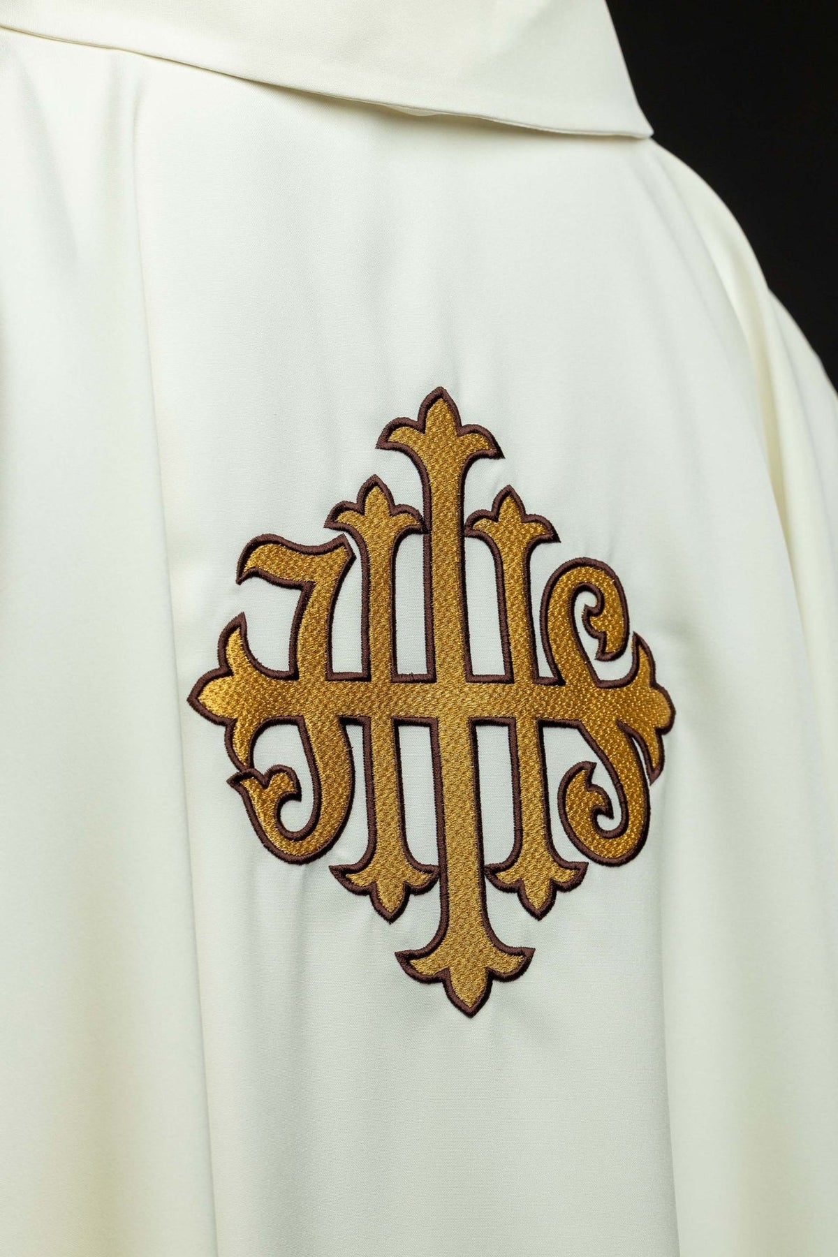 Ecru chasuble shoulder detail showing the wide square collar