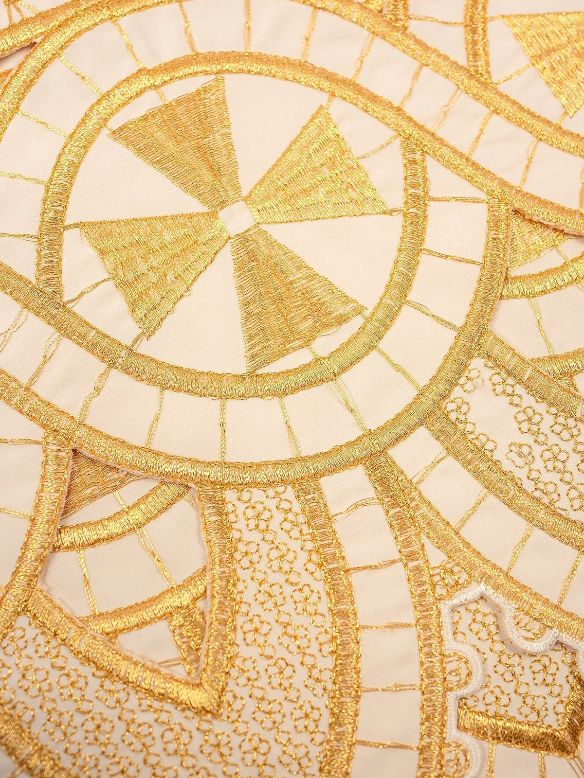 Altar lace close-up showing gold embroidery, cross motif and floral detailing