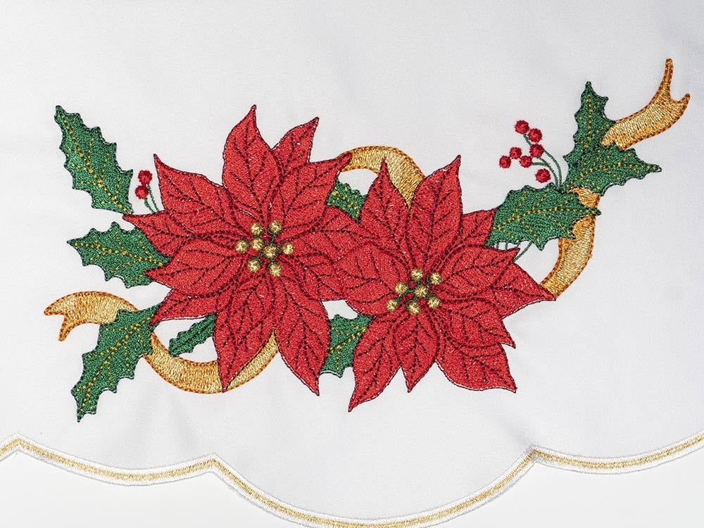 Christmas altar cloth close-up showing red poinsettia, green holly and gold embroidery