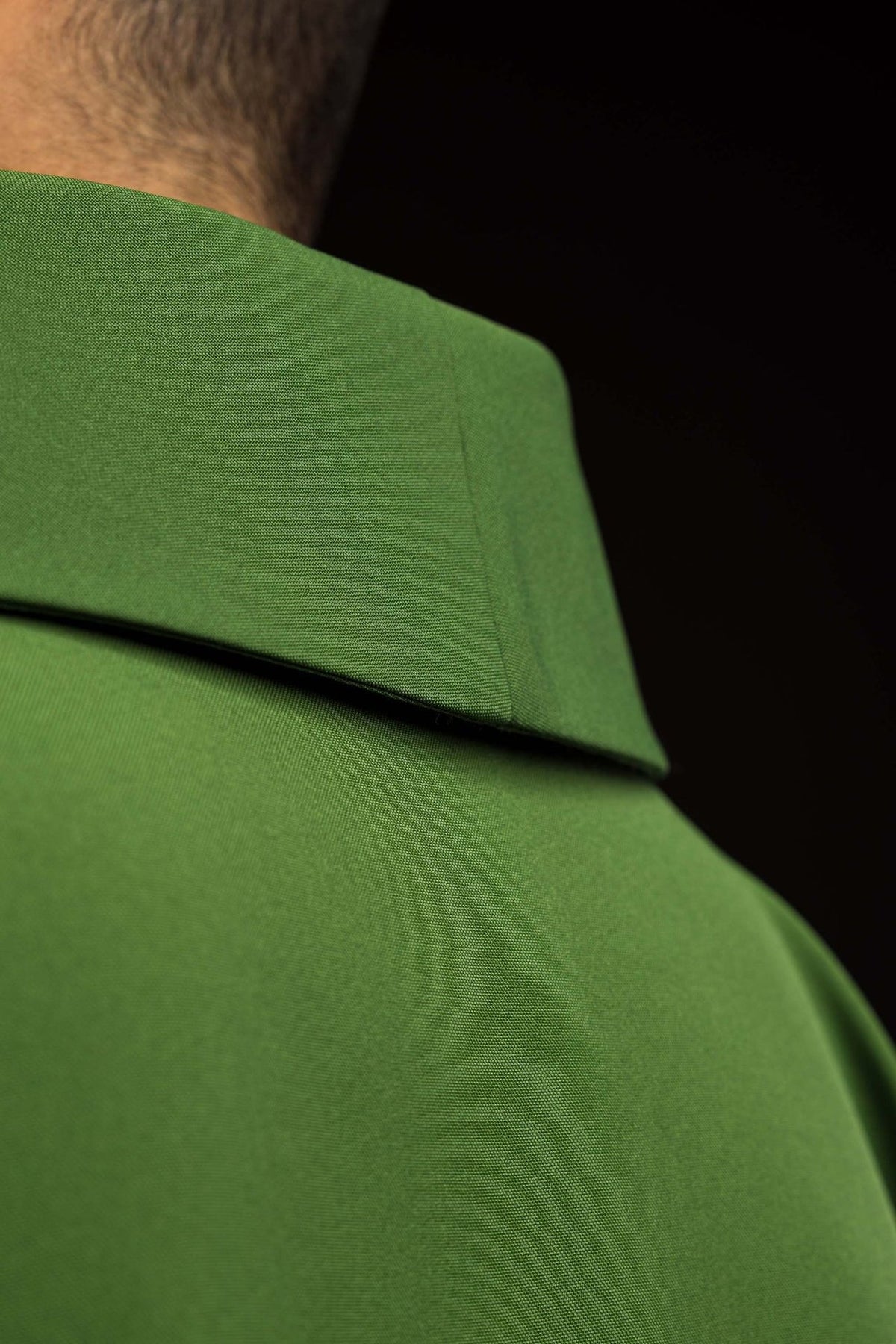 Green chasuble close-up showing the stand-up collar