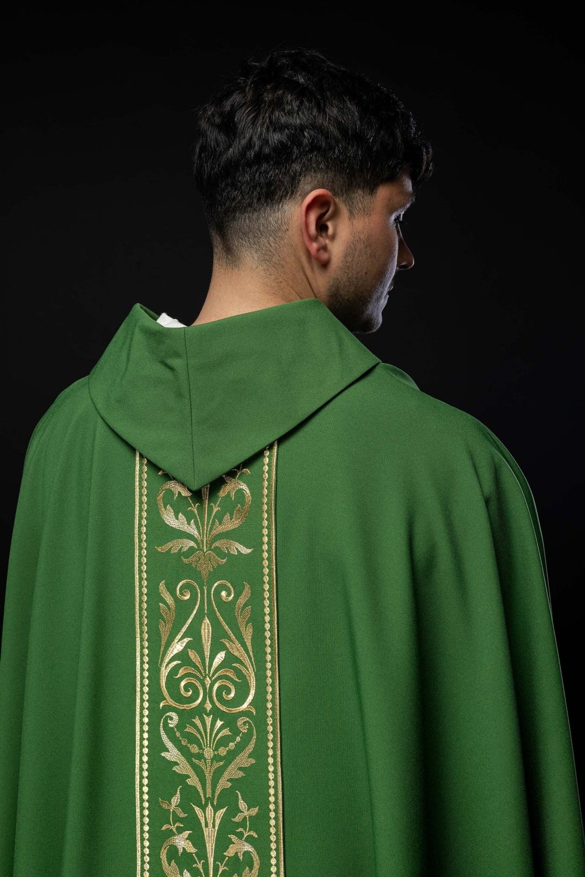 Green chasuble back detail with gold embroidered orphrey and stand-up collar
