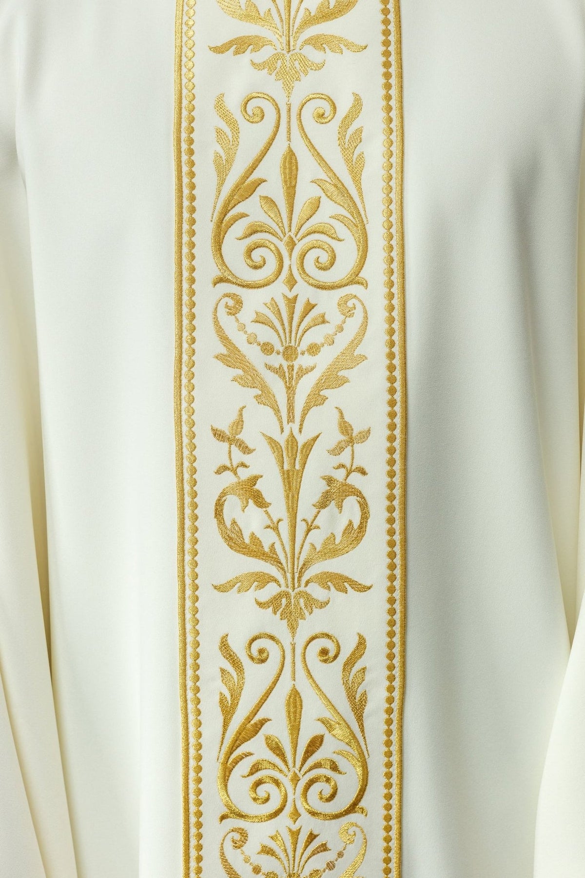 Ecru chasuble orphrey close-up with repeating gold floral and scroll embroidery