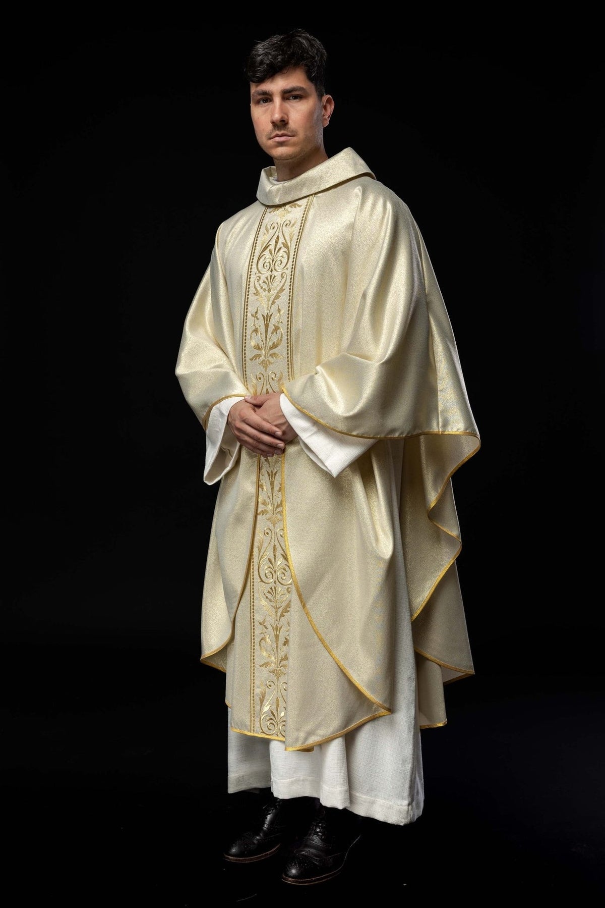 Liturgical chasuble, three-quarter front view with embroidered gold orphrey