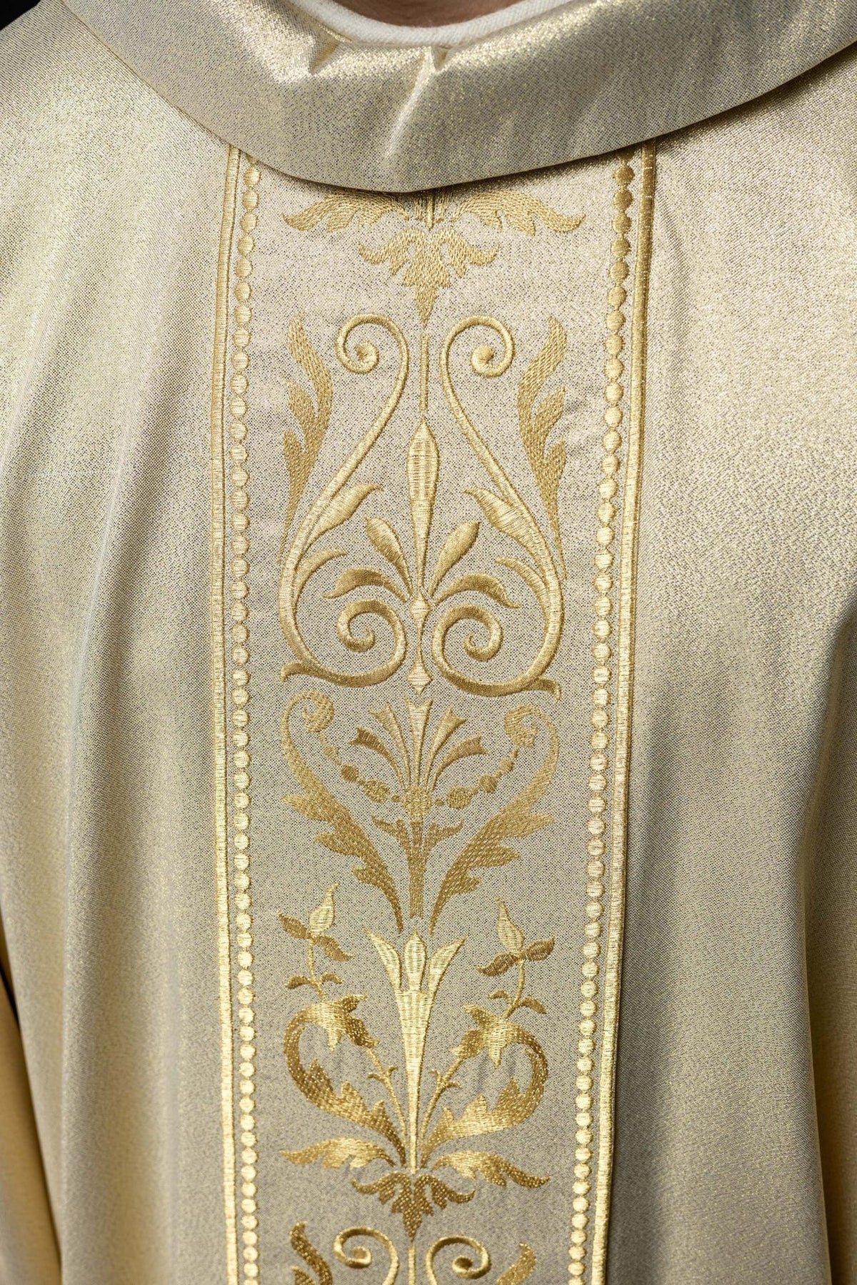 Liturgical chasuble, close-up of embroidered gold floral orphrey