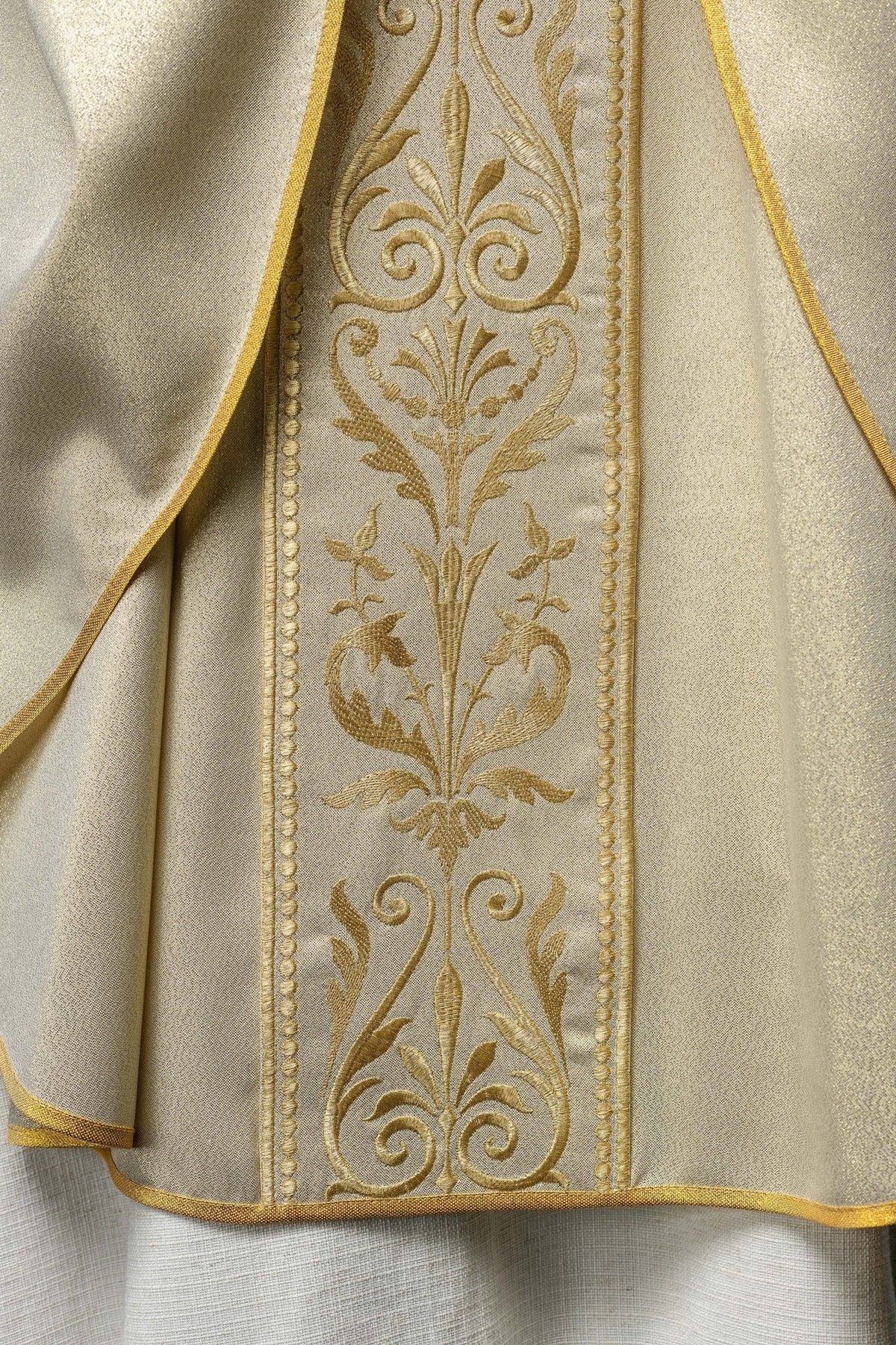 Liturgical chasuble, front detail showing gold embroidered floral orphrey and trim