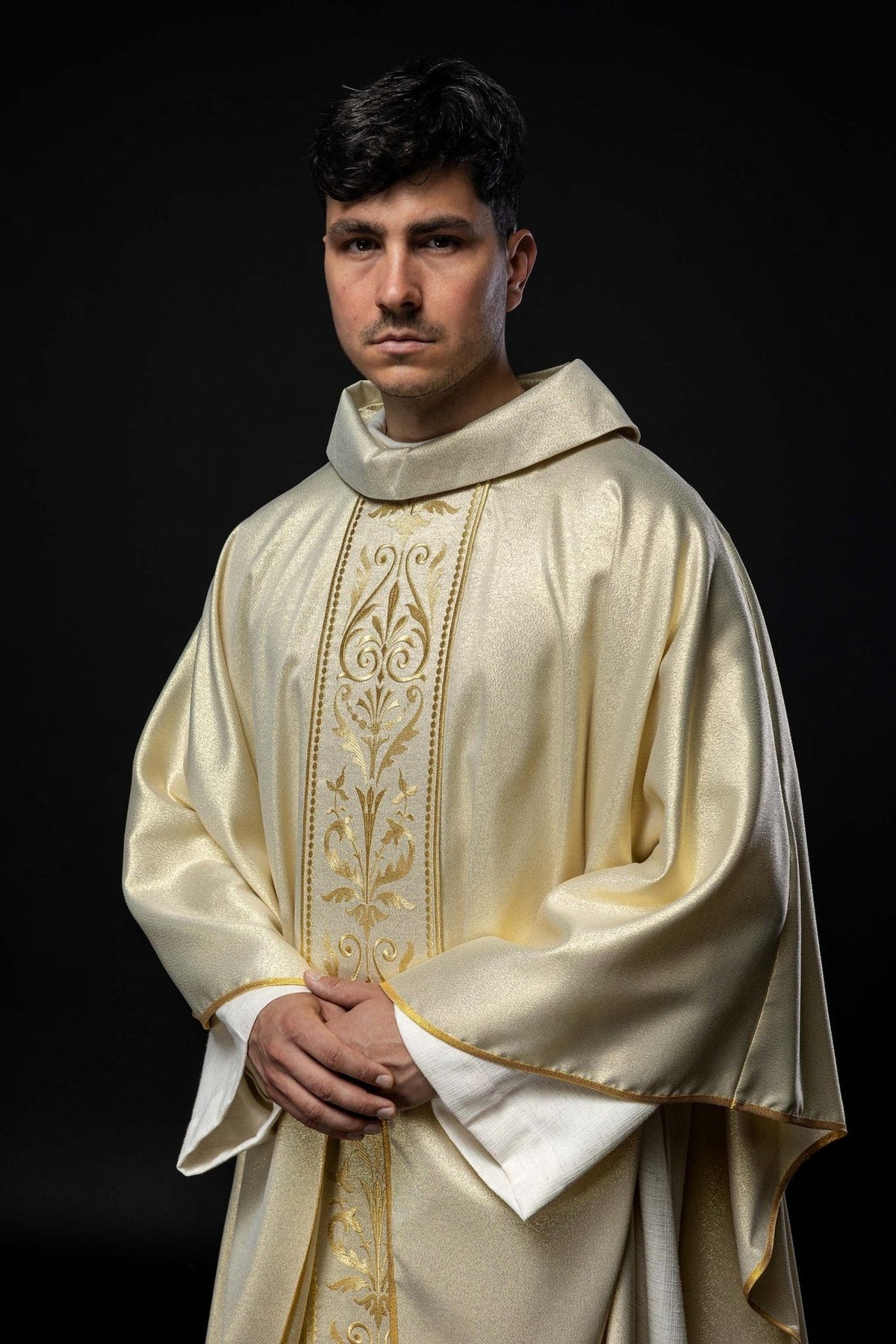 Liturgical chasuble, side front view showing gold trim and wide satin sleeves