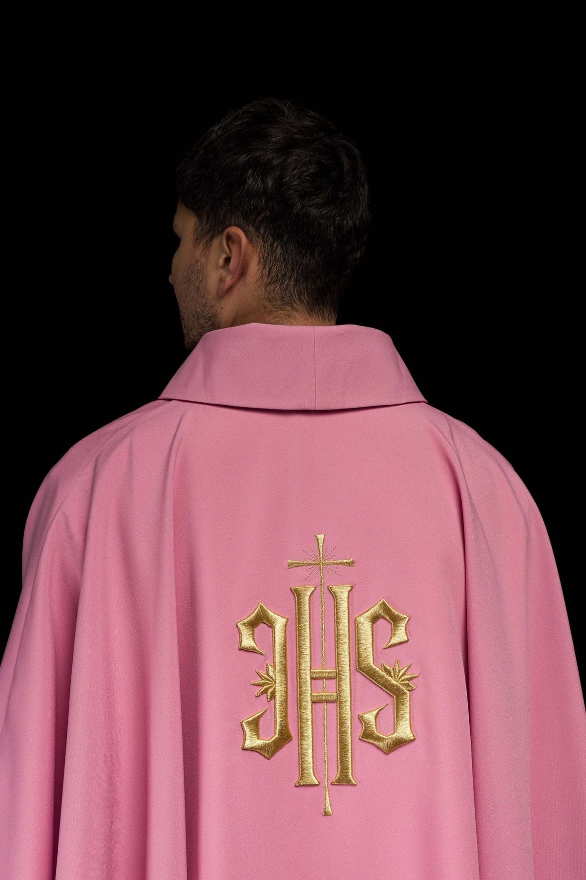 Rose chasuble back close-up with stand-up collar and partial gold IHS embroidery