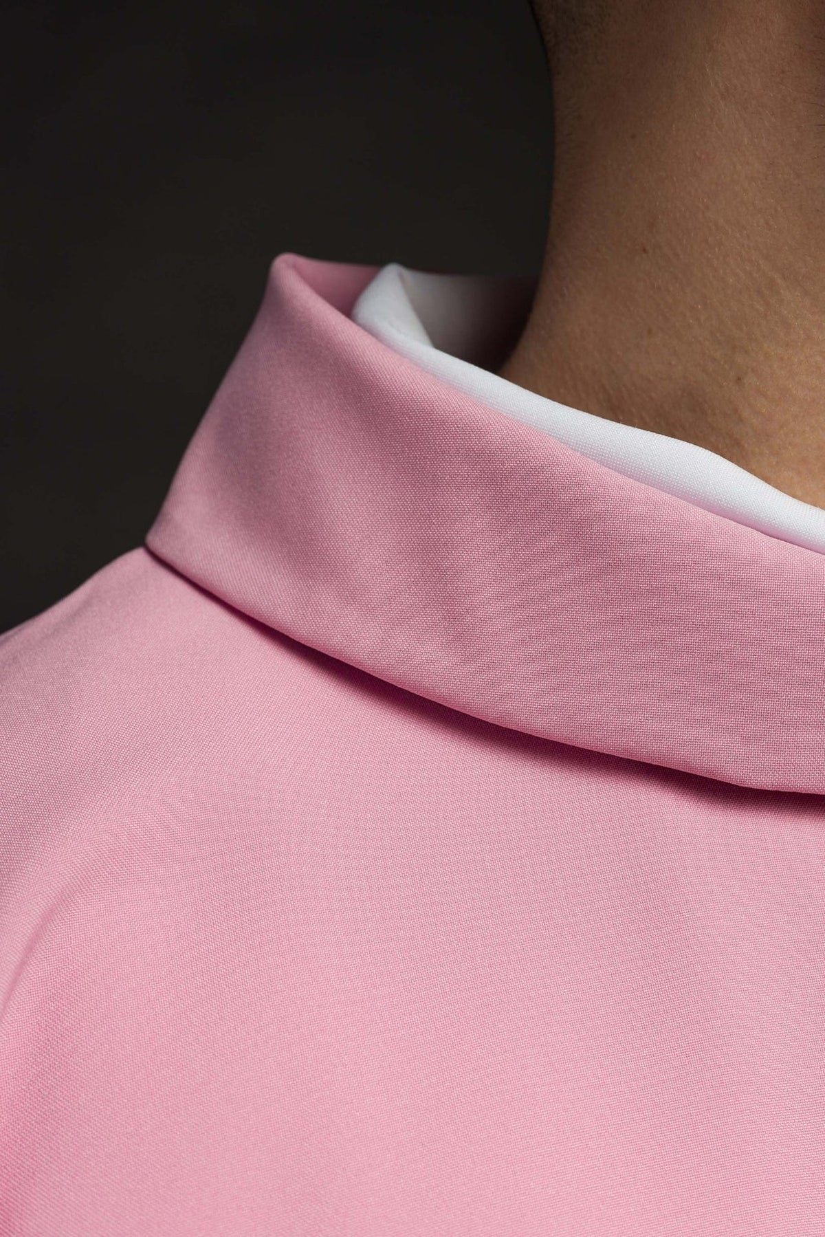 Chasuble close-up showing pink fabric and folded stand-up collar