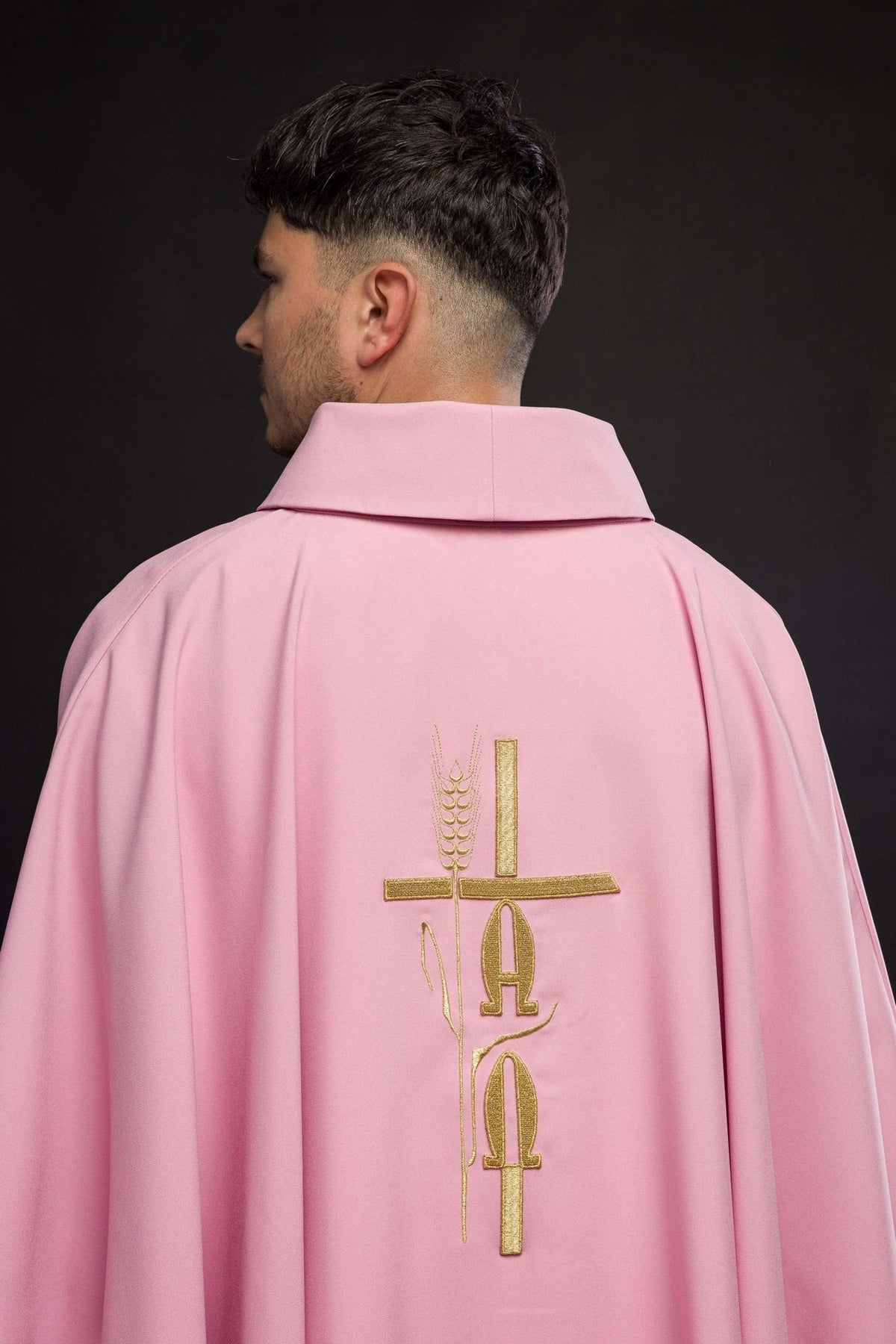 Pink chasuble back view with gold cross, IHS and rose embroidery