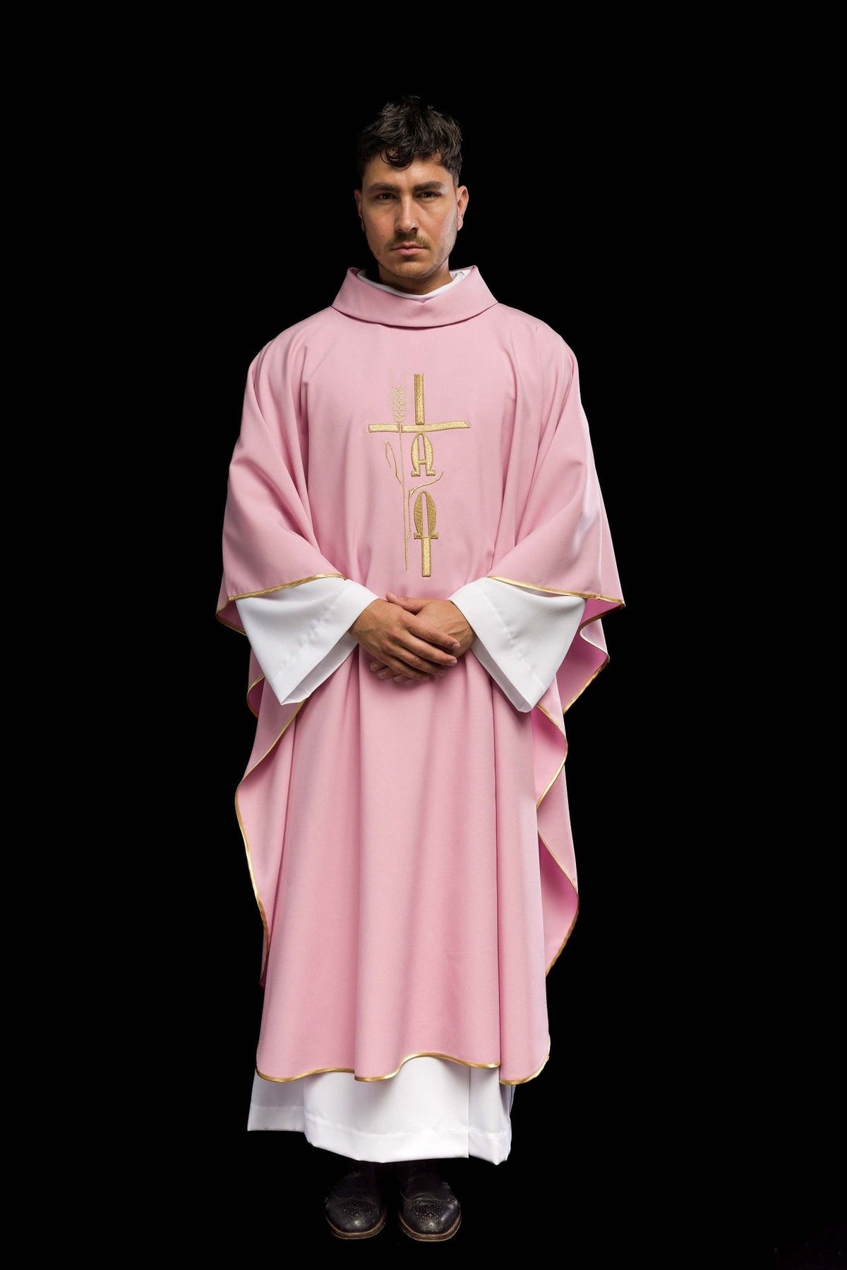 Pink chasuble front view with gold embroidery, cross, IHS and trim