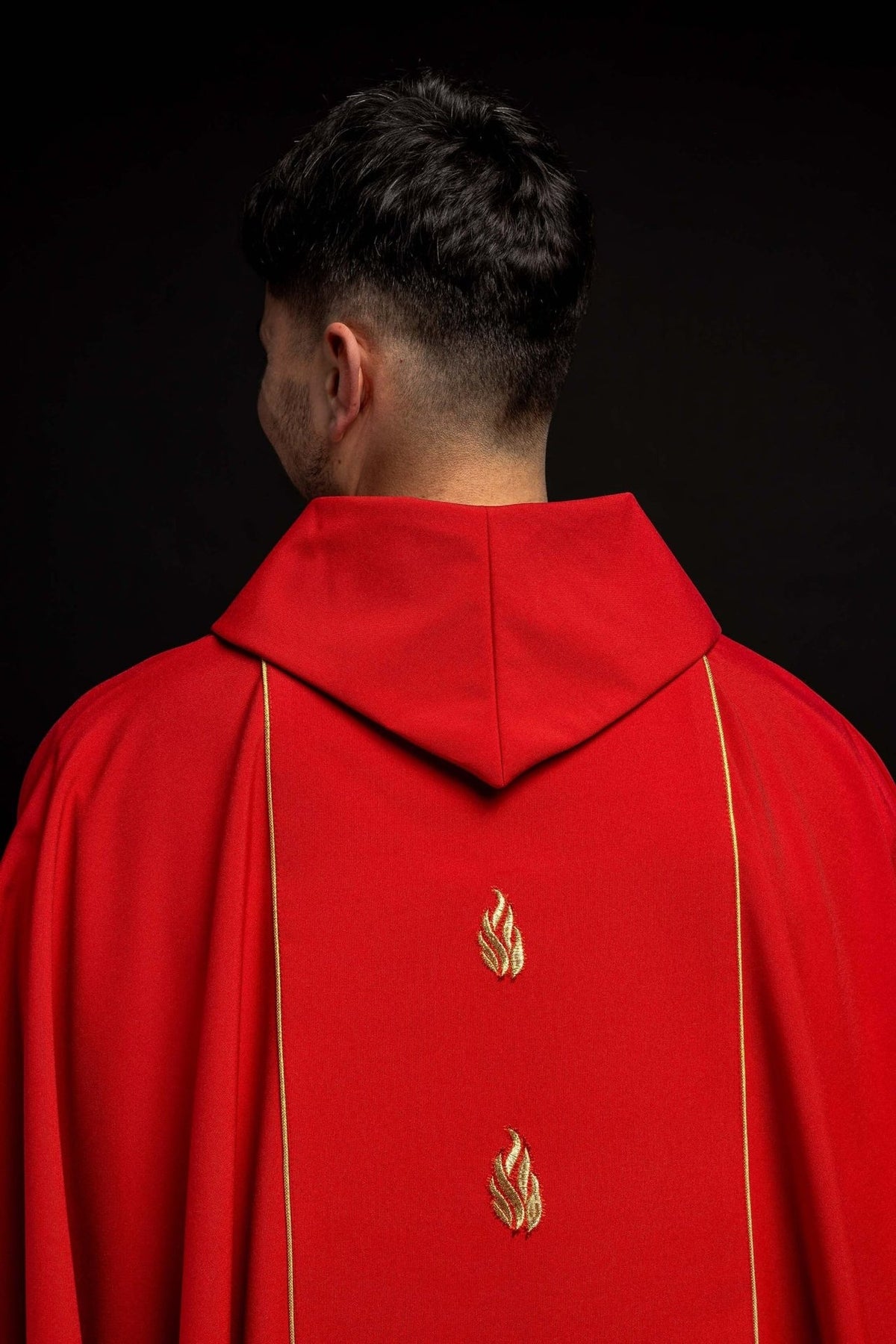Red chasuble close-up of Holy Spirit embroidery stitching