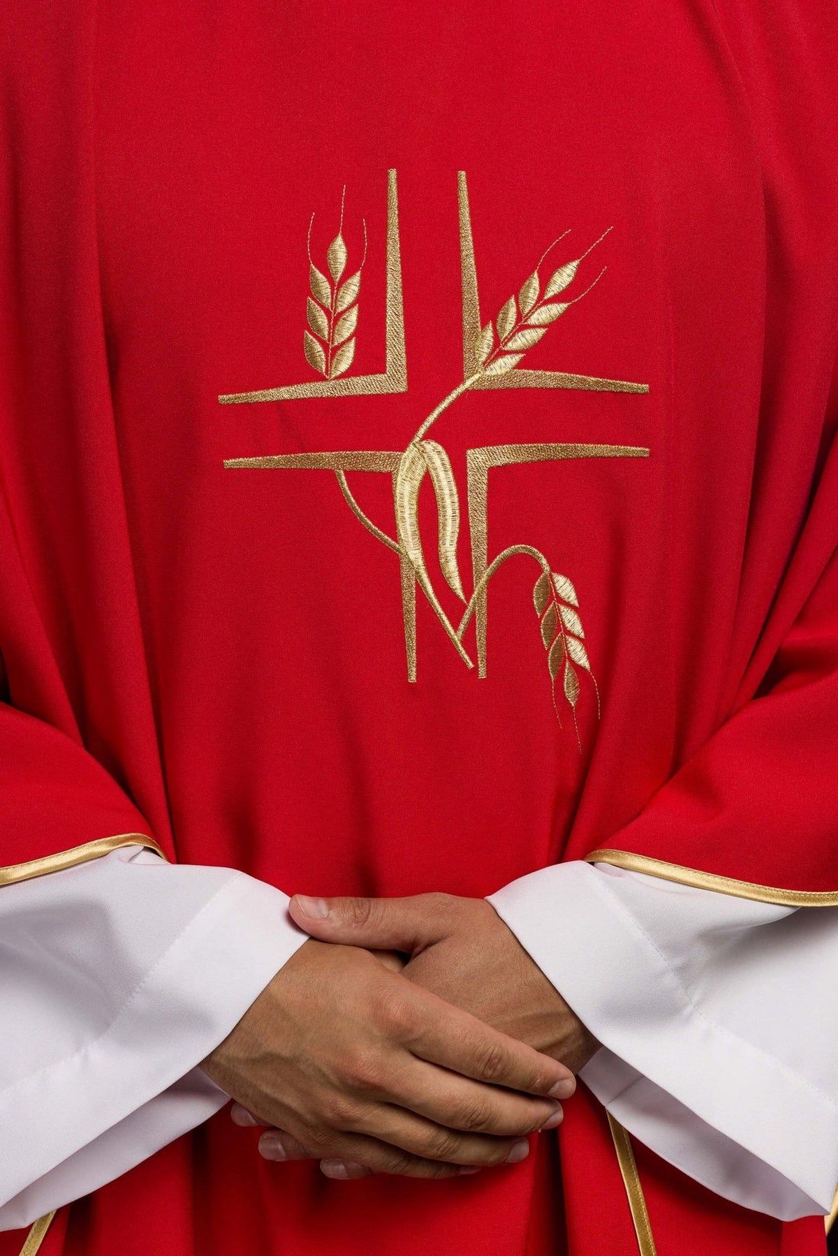 Red chasuble front close-up showing gold cross and wheat embroidery