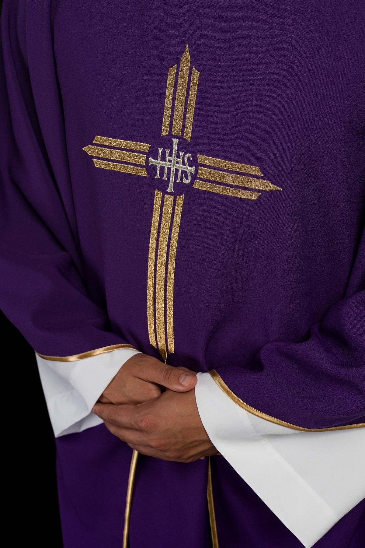Purple chasuble close-up of gold IHS cross embroidery