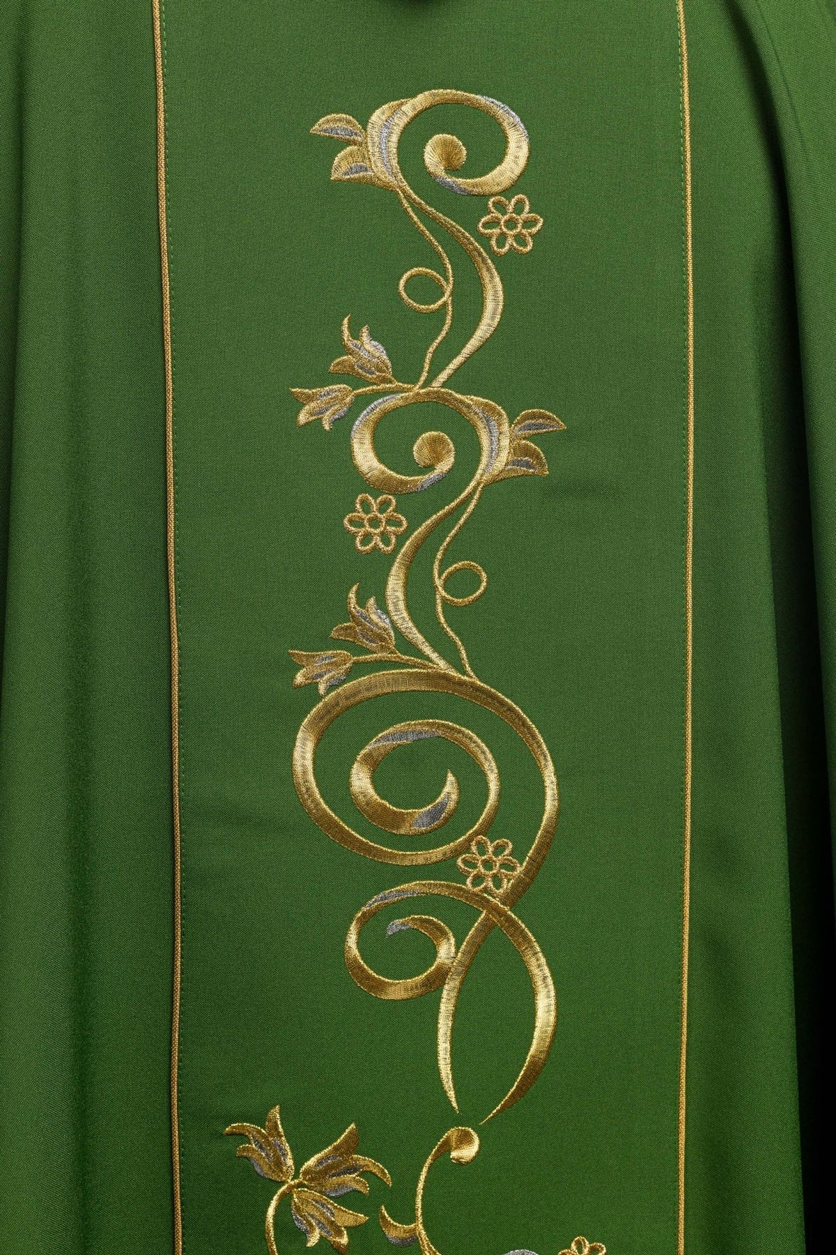 Green chasuble close-up showing gold floral embroidery on the orphrey