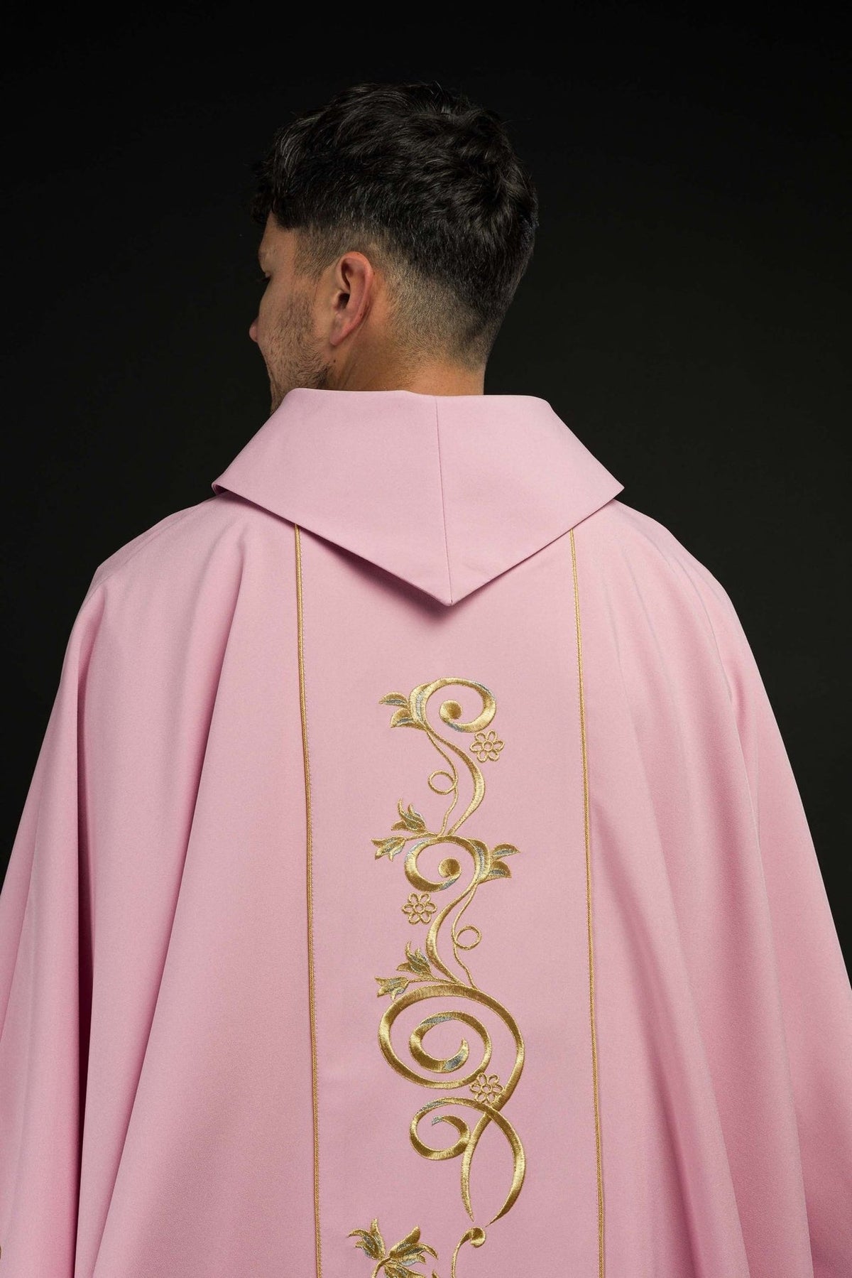 Rose chasuble back view with gold floral embroidery and trim