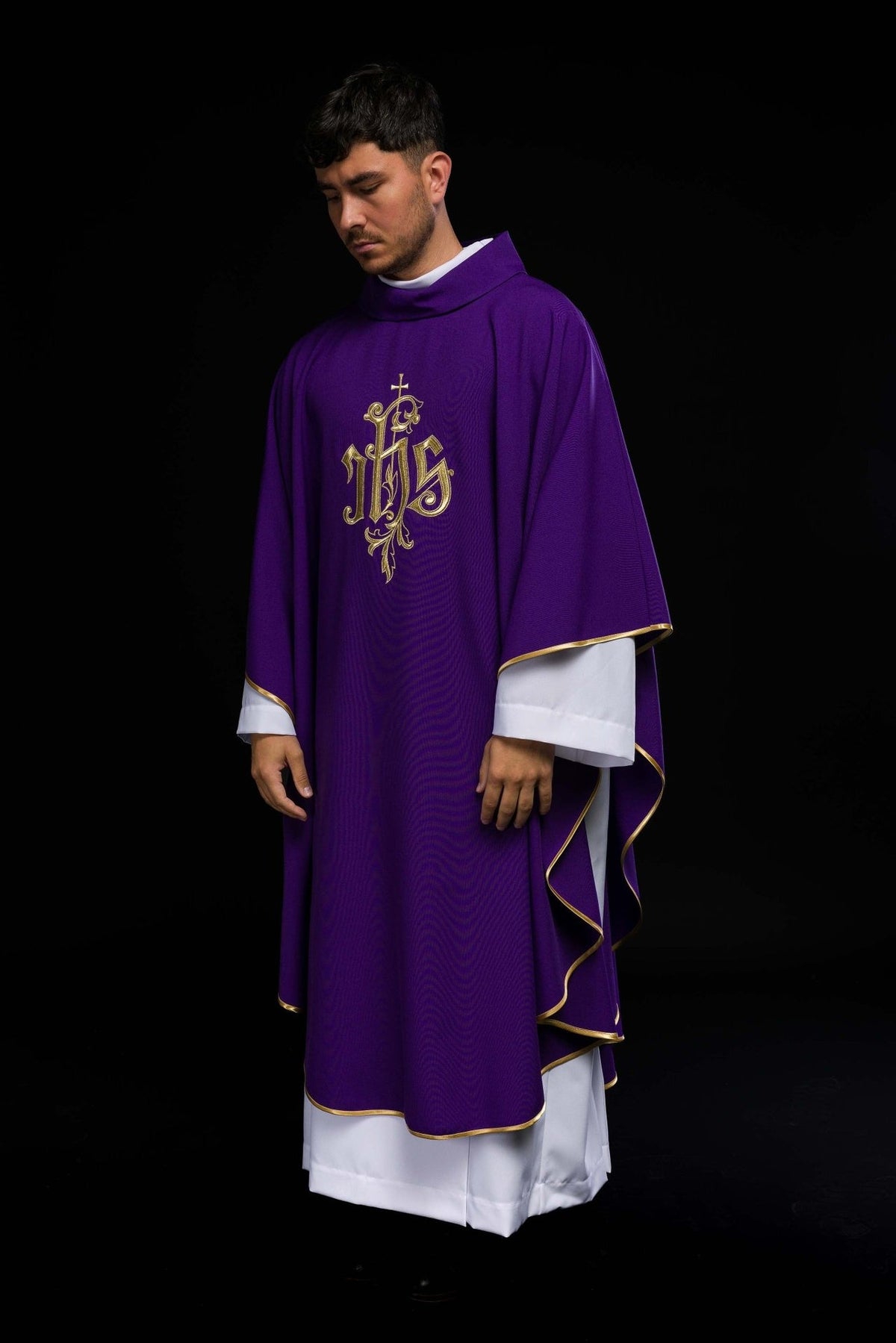 Purple chasuble, side view showing flowing cut and gold trim