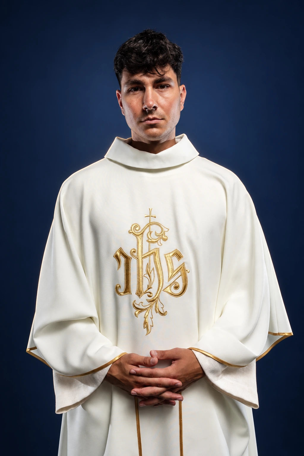 Cream Chasuble with Gold IHS Embroidery worn from the front, with gold trim and stand-up collar