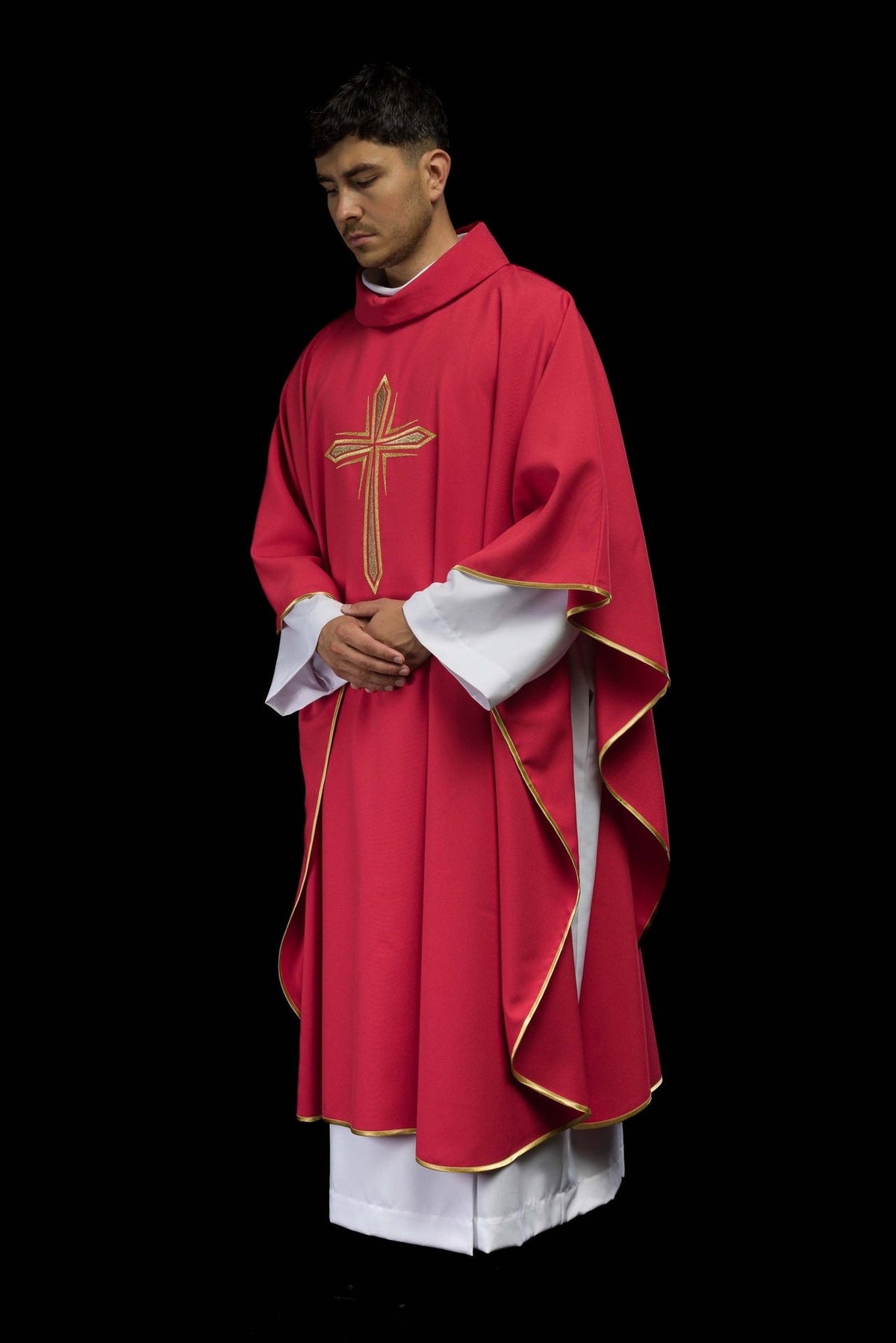 Red chasuble side view showing flowing shape and gold trim